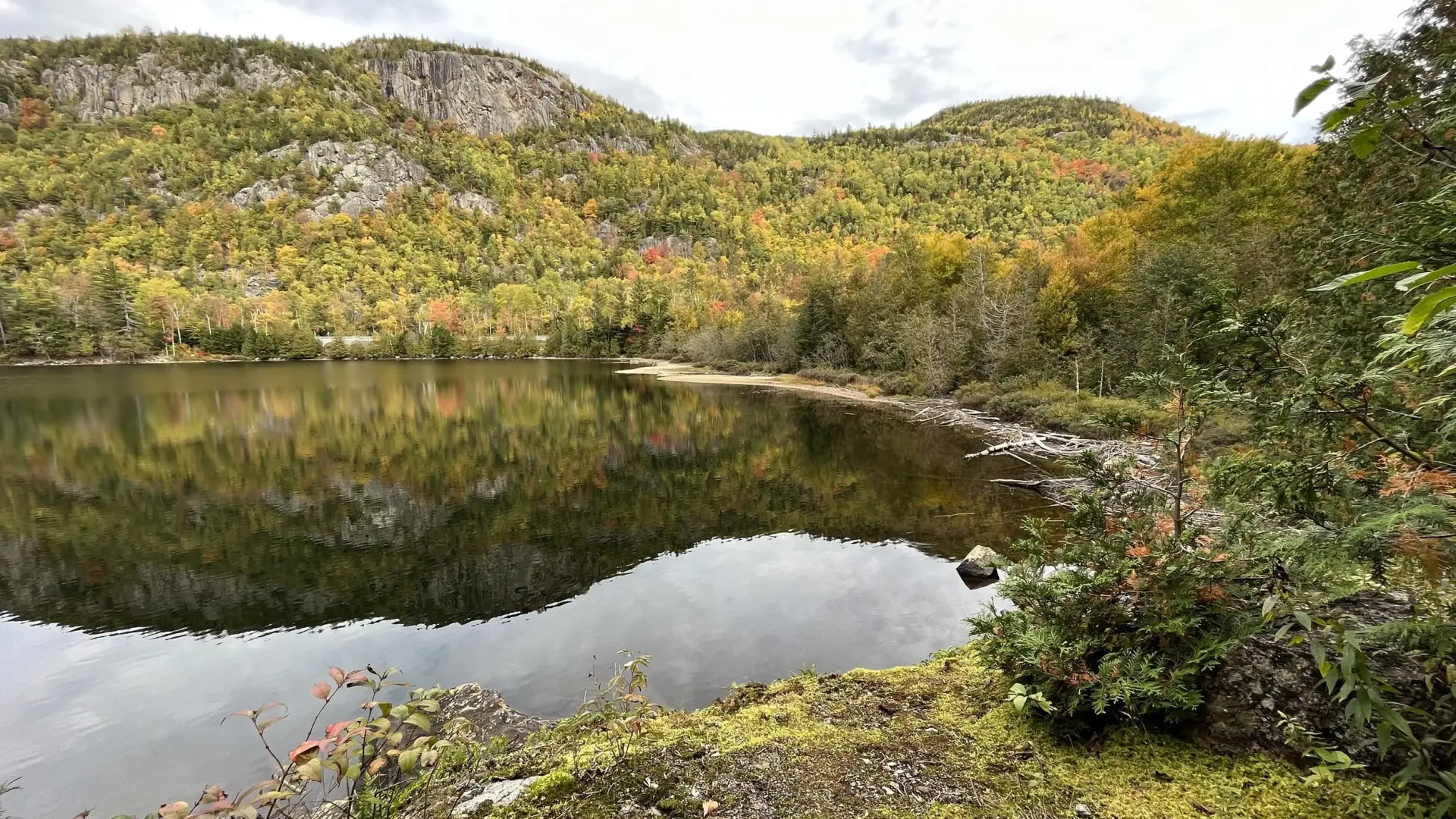 View of an isolated alpine lake with a beautiful peak in the background