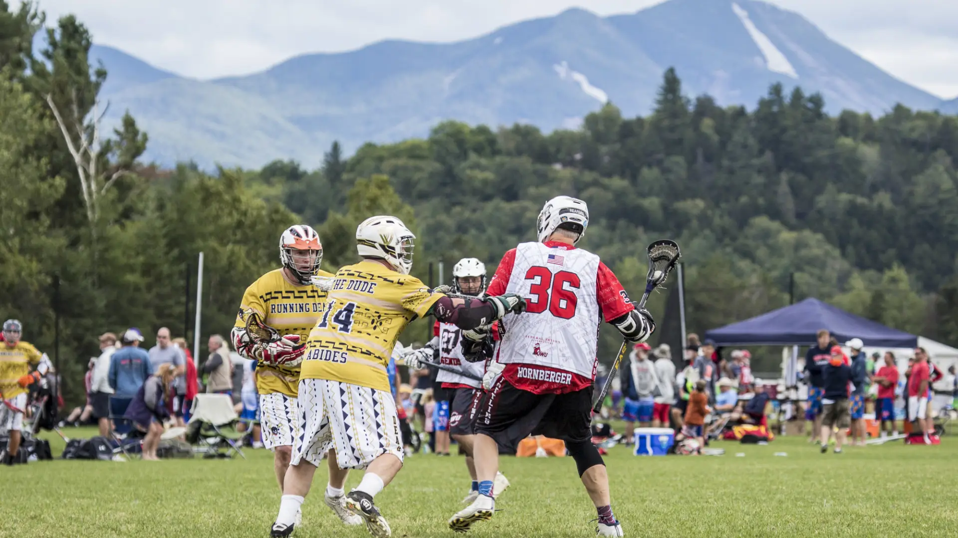lacrosse players try to get the ball in front of High Peaks.