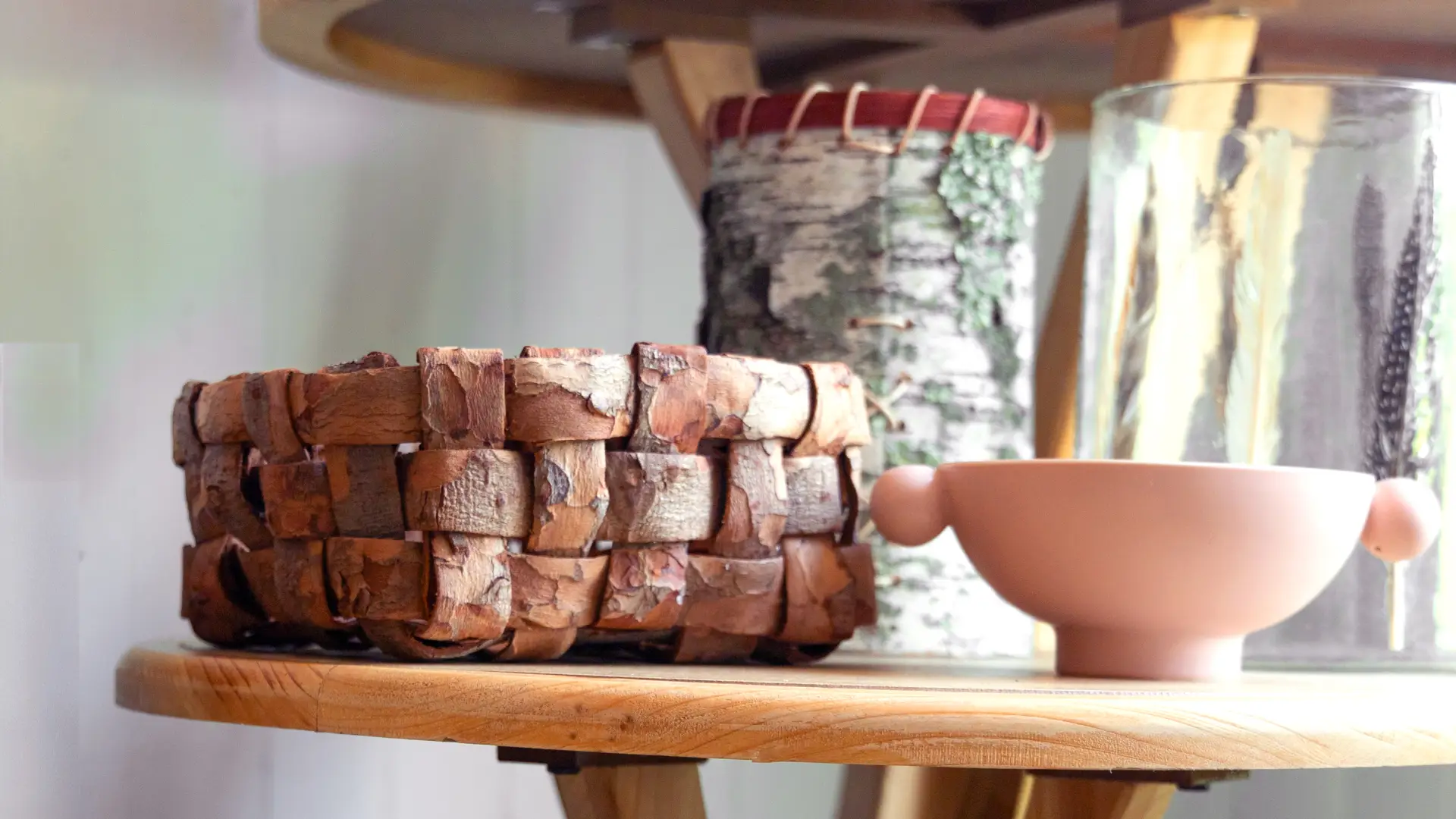 Rustic decor like wooden bowls and woven bark baskets