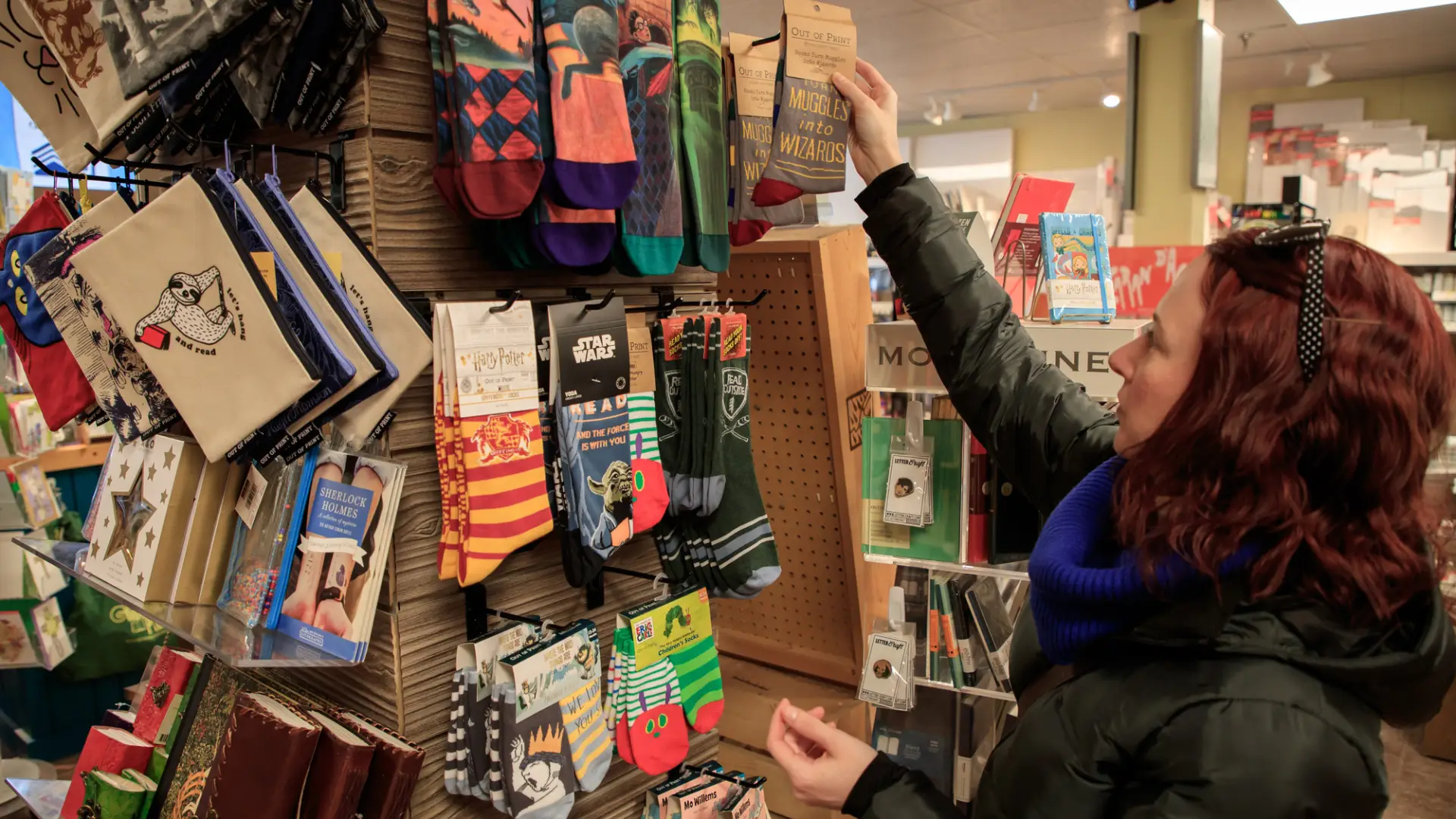 A woman shopping in Lake Placid for colorful socks