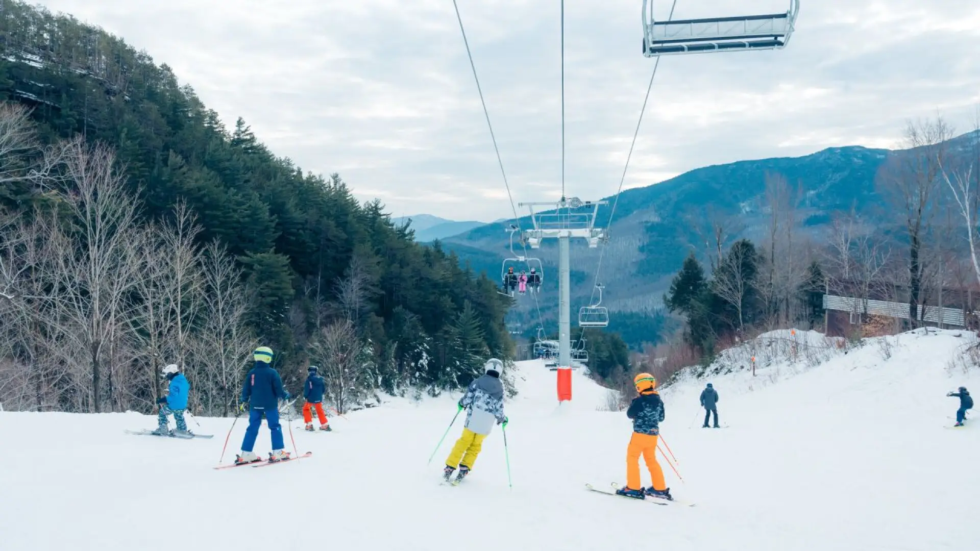 Skier ride the slopes under the chairlift at Whiteface Mountain Ski Resort