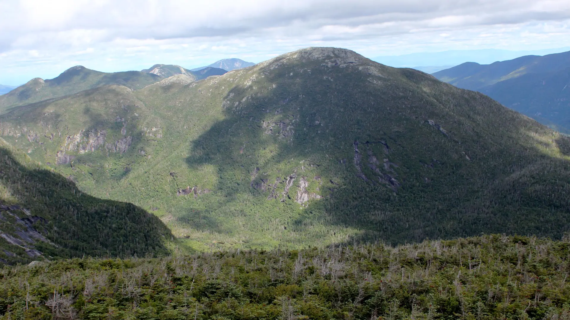 See 30 High Peaks from the summit of Skylight.