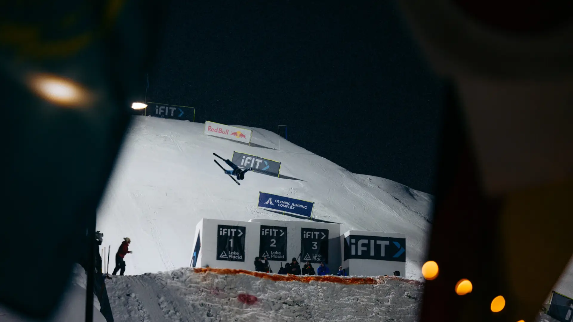 A high-angle aerial photograph of the Olympic Jumping Complex in Lake Placid during winter.