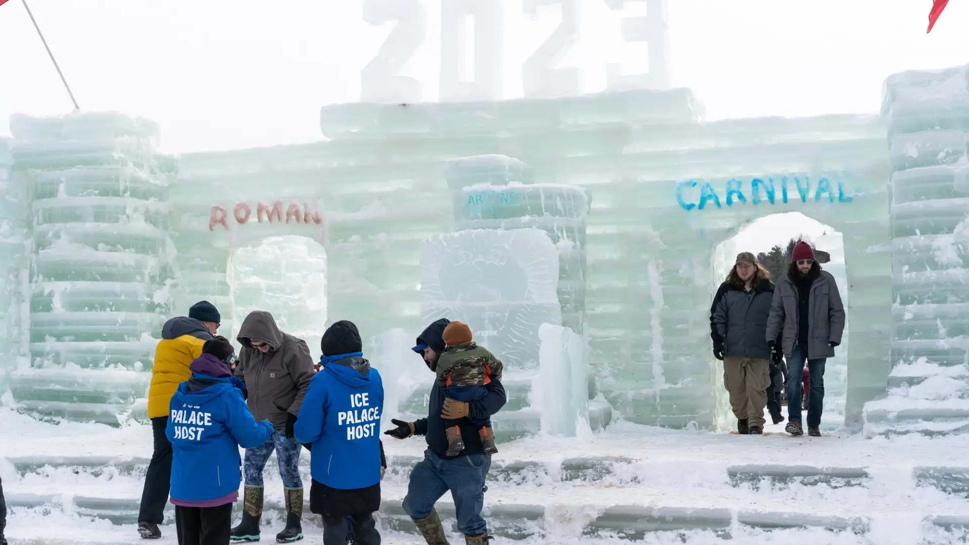 people walking around the ice castle