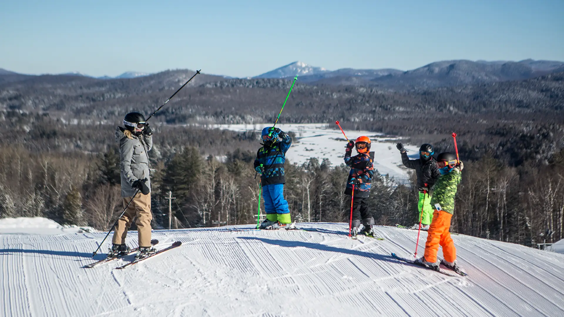 A few people at the top of Mt Pisgah ready to ski down