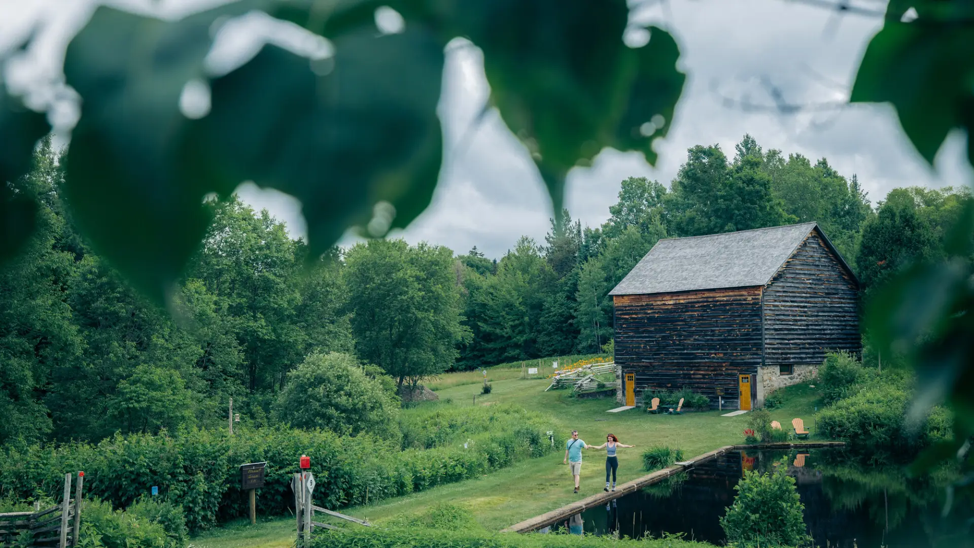 A couple hiking at John Brown Farm in Lake Placid, NY.