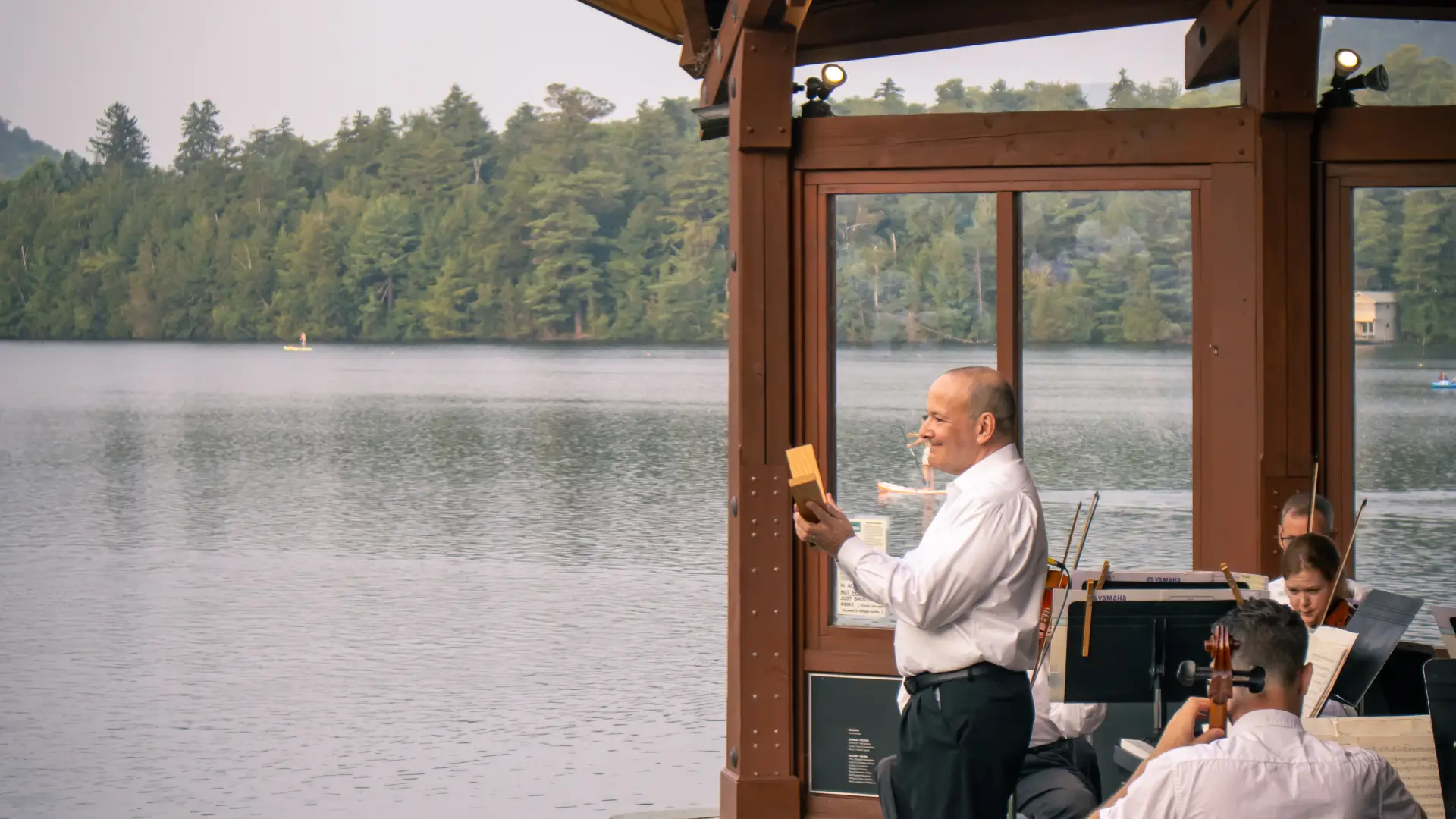Conductor from within the orchestral shell overlooking Mirror Lake Credit to: Jacob Rushlow