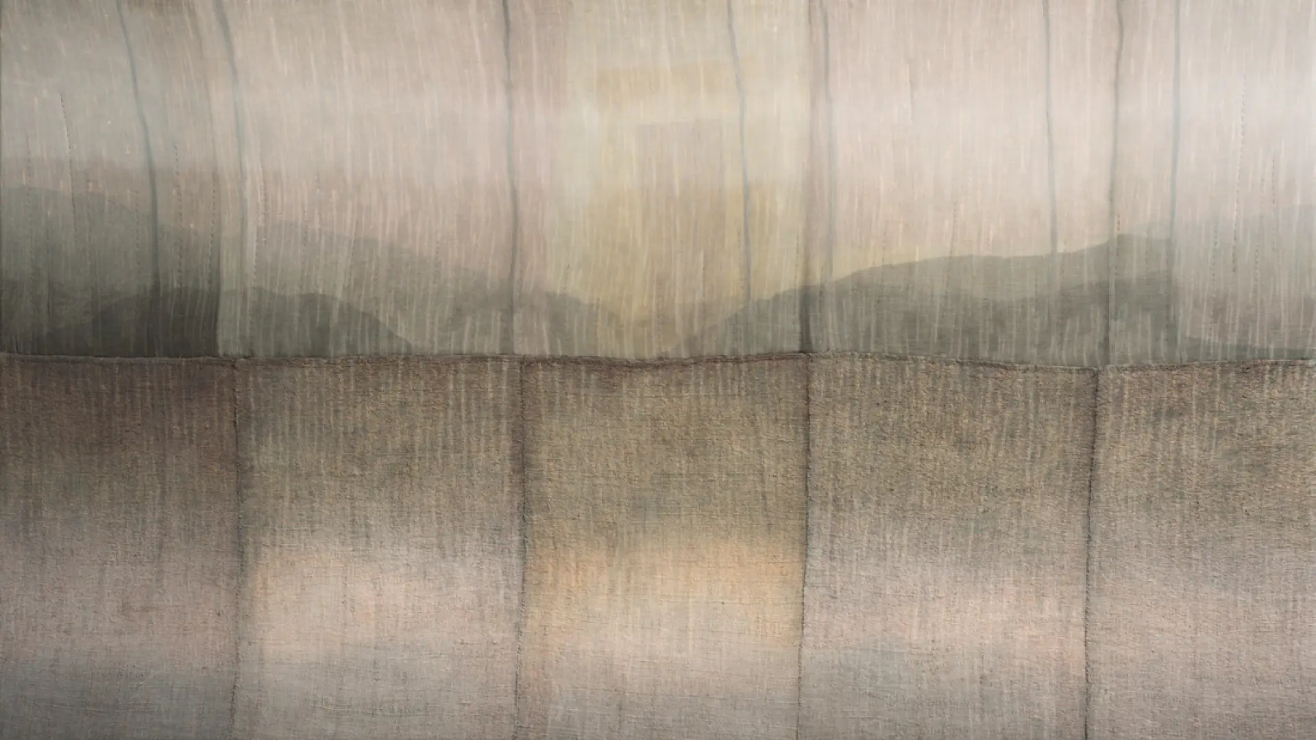 Art piece of unknown material pieces that appears to have a mountainous watercolor design