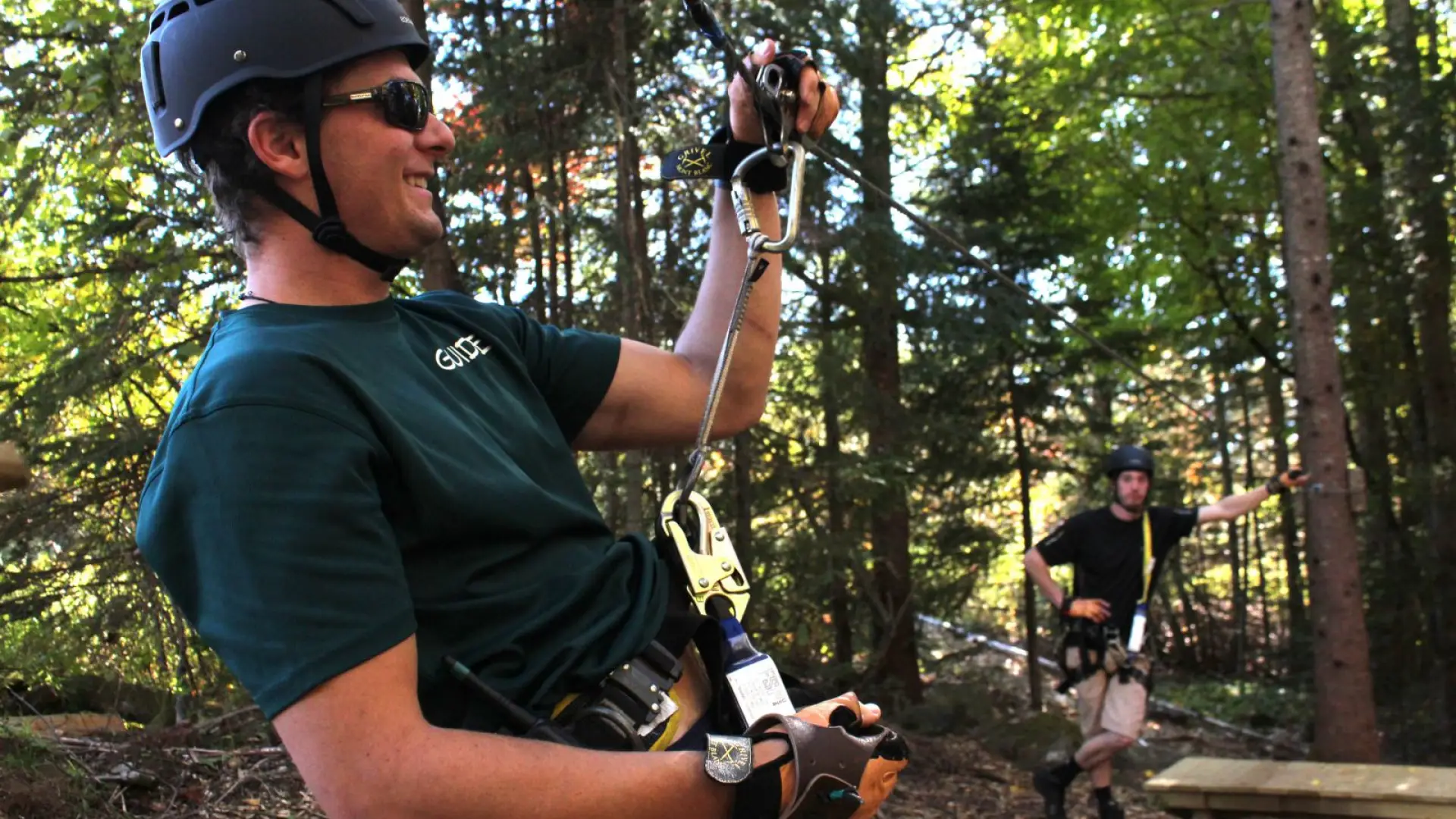 Swamp Donkey flexes as he explains the braking system while Big Wheels watches.