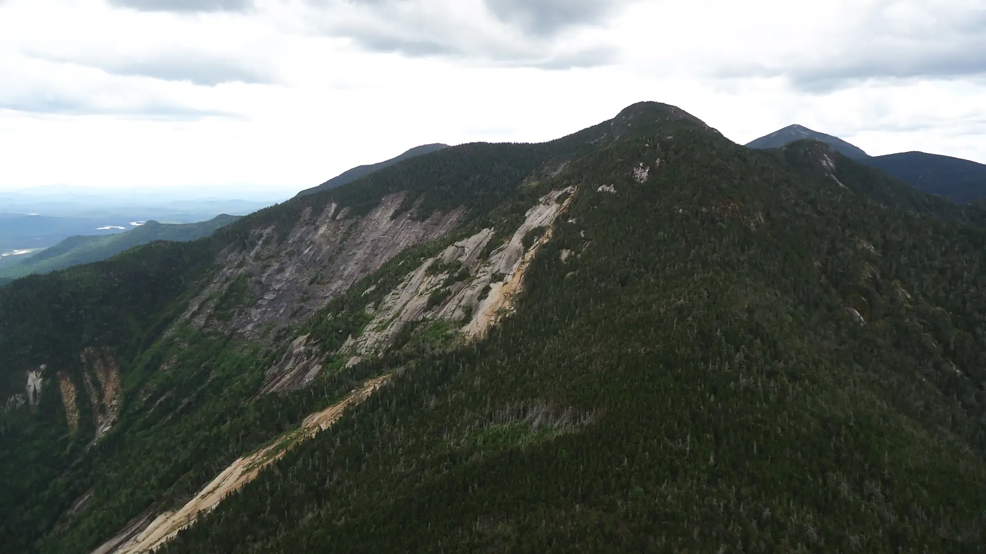 View of a tall mountain with rock slides