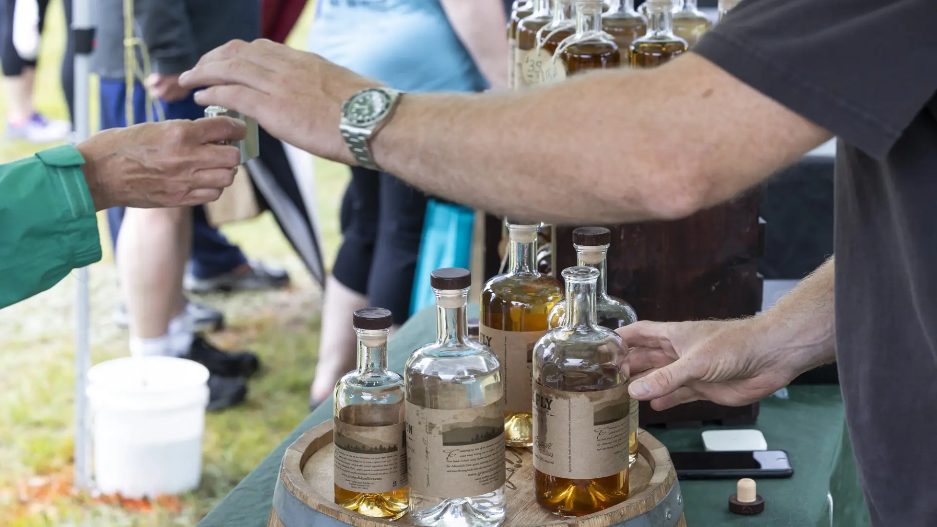 Vendor pours whiskey sample