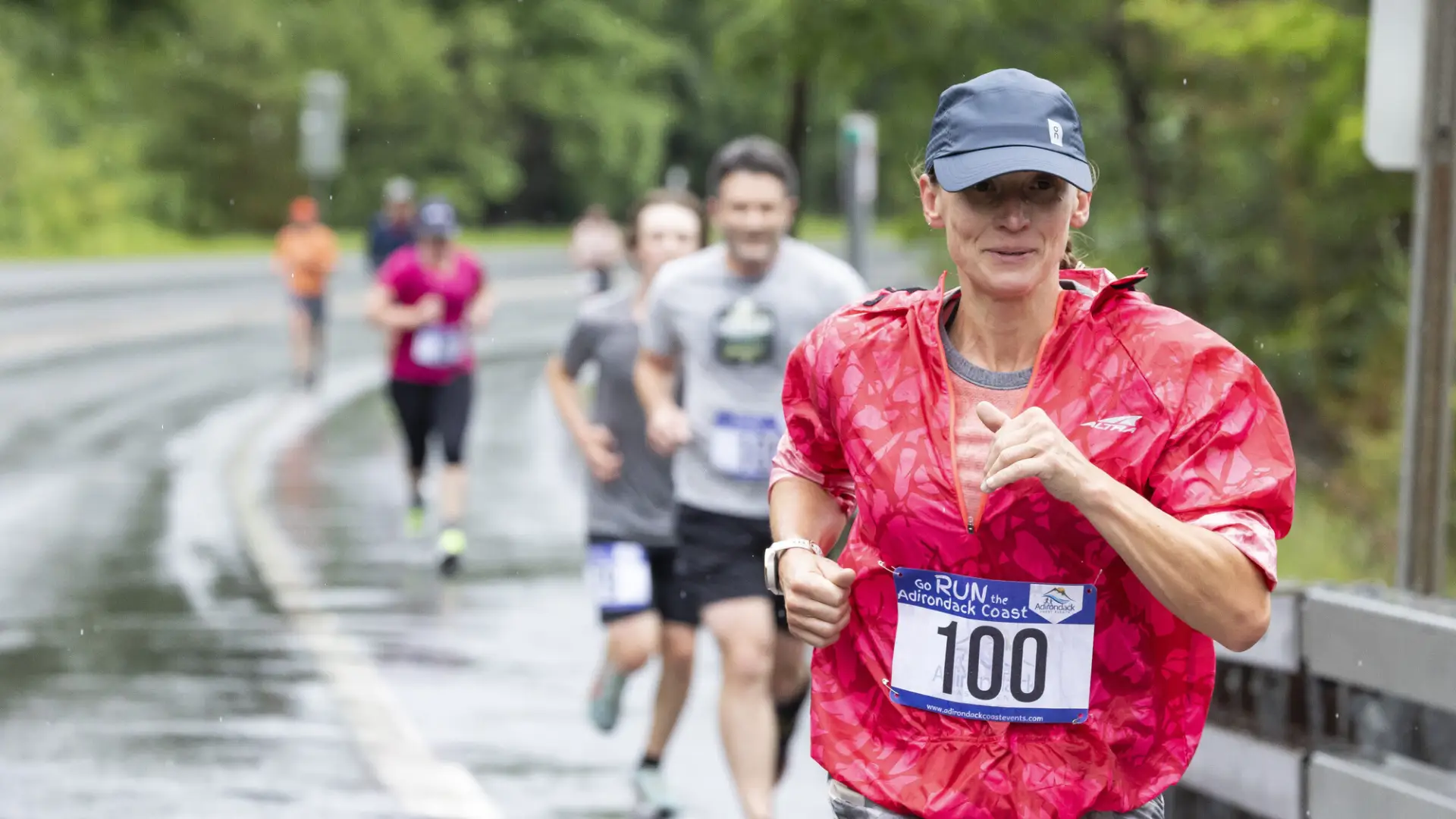 Racers run down wet road