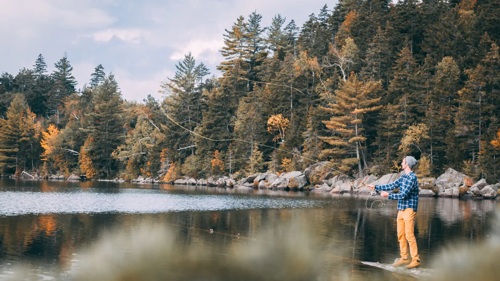 A fly fisher in the fall