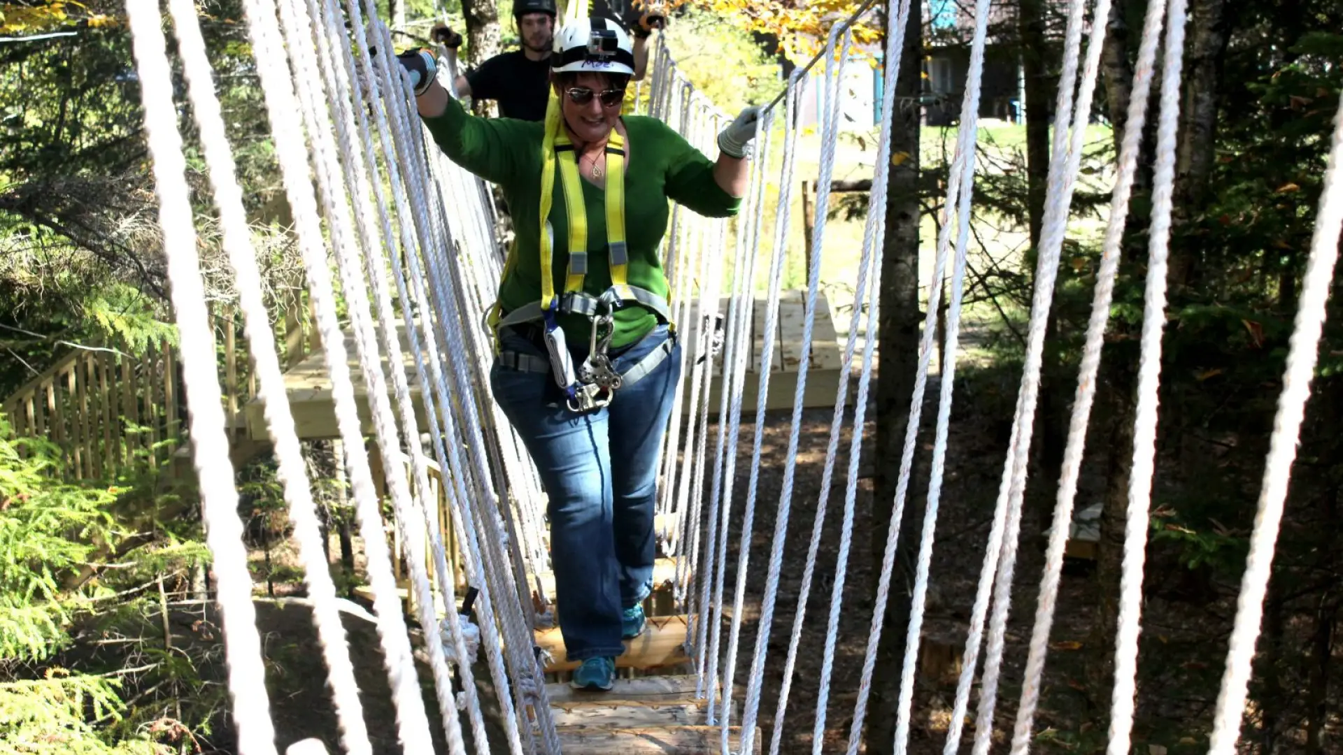 Jess takes the first bridge one wobbly step at a time.