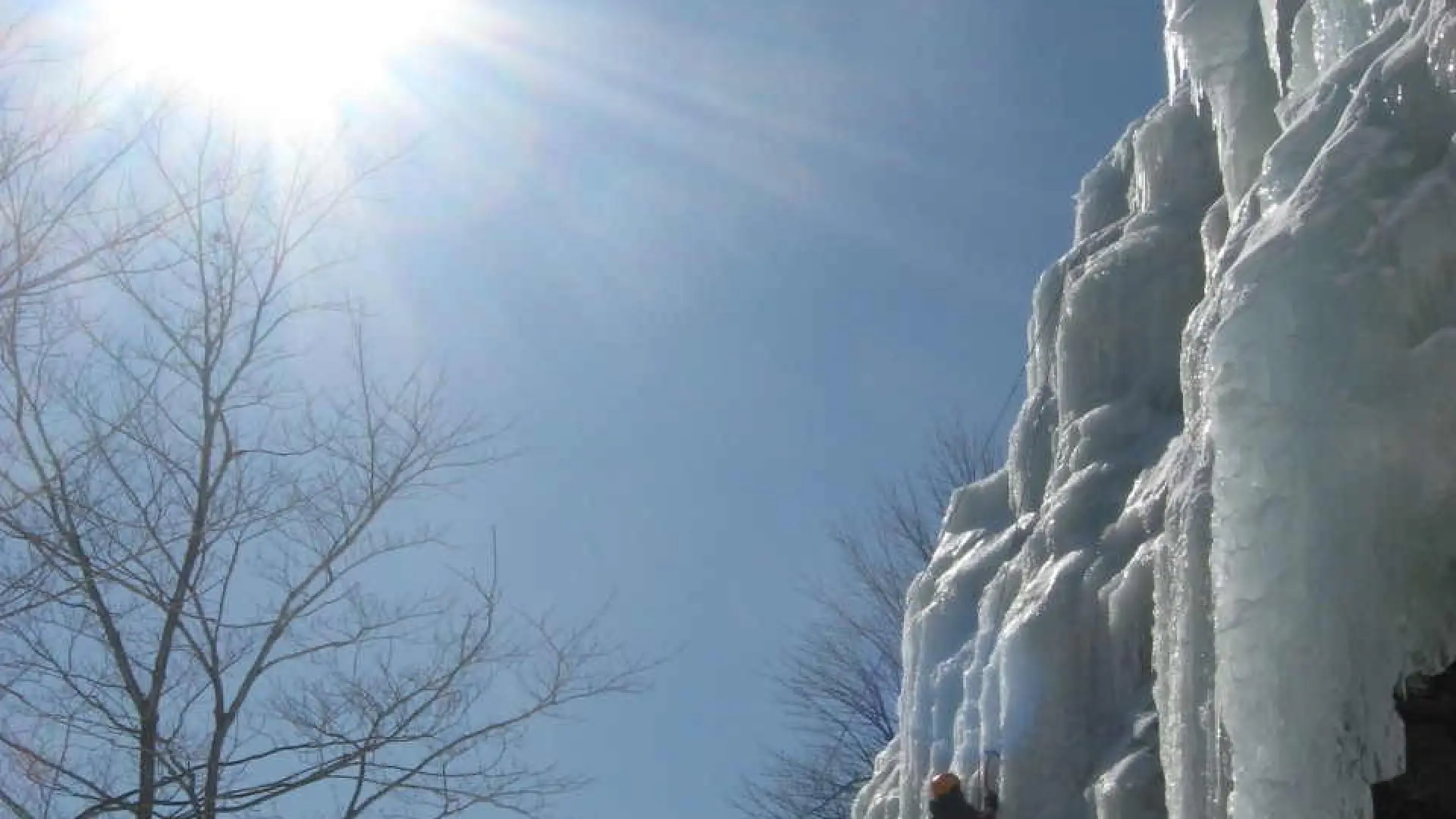 A wall of ice on rock in the sun
