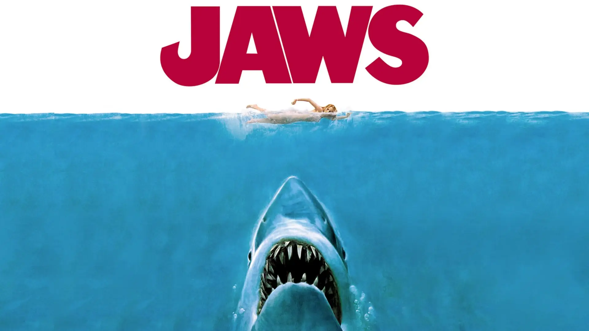 Jaws movie promotional image with great white shark rising in water at swimmer and Jaws written in bright red letters