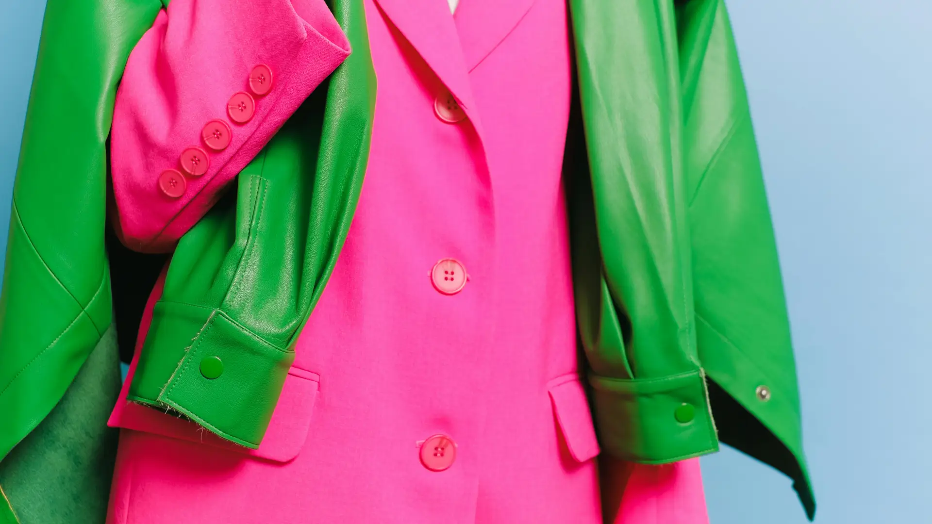 stock image of hot pink blazer on mannequin with bright green jacket overlaid