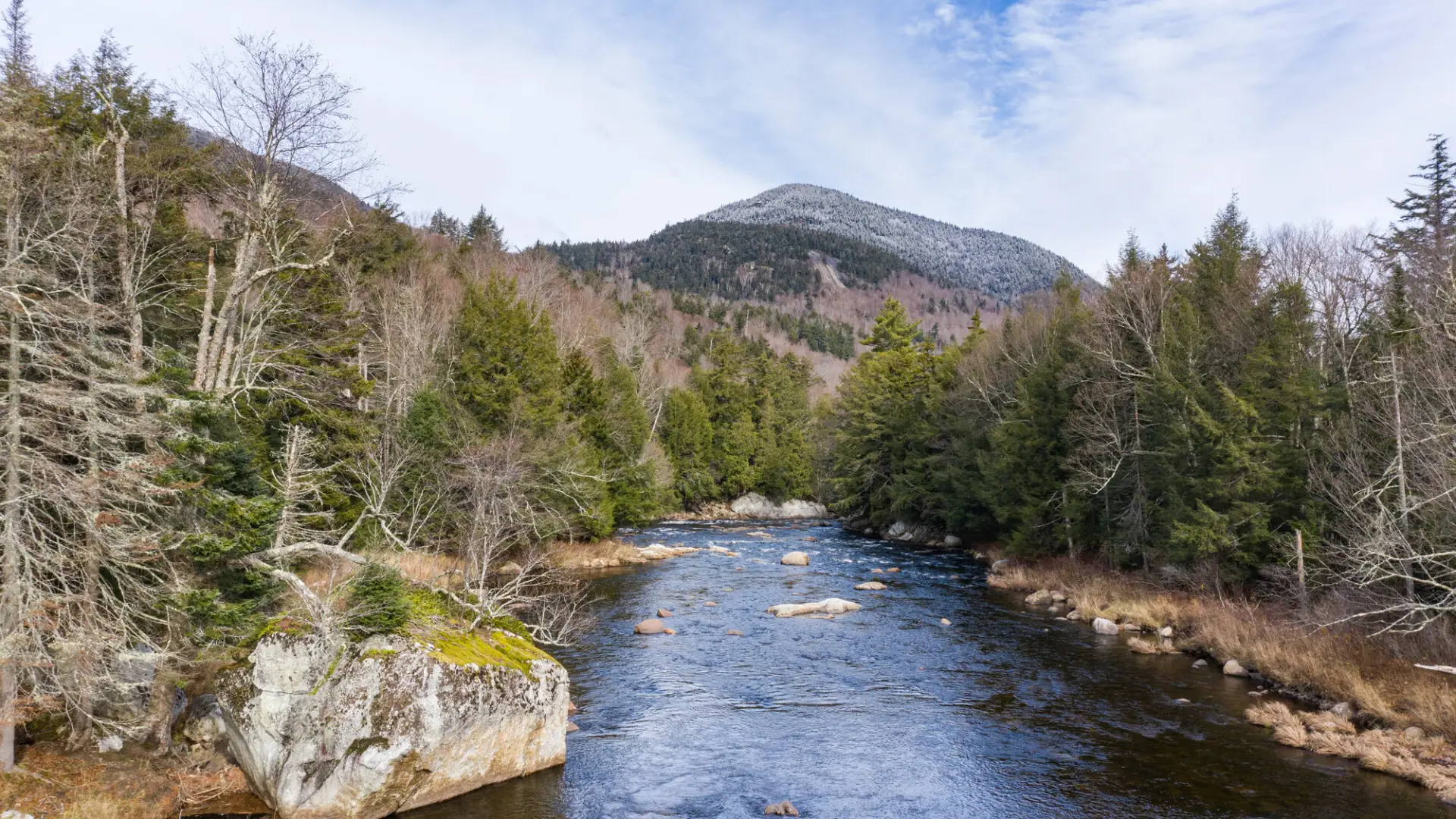 Scenic image of mountain and river in spring
