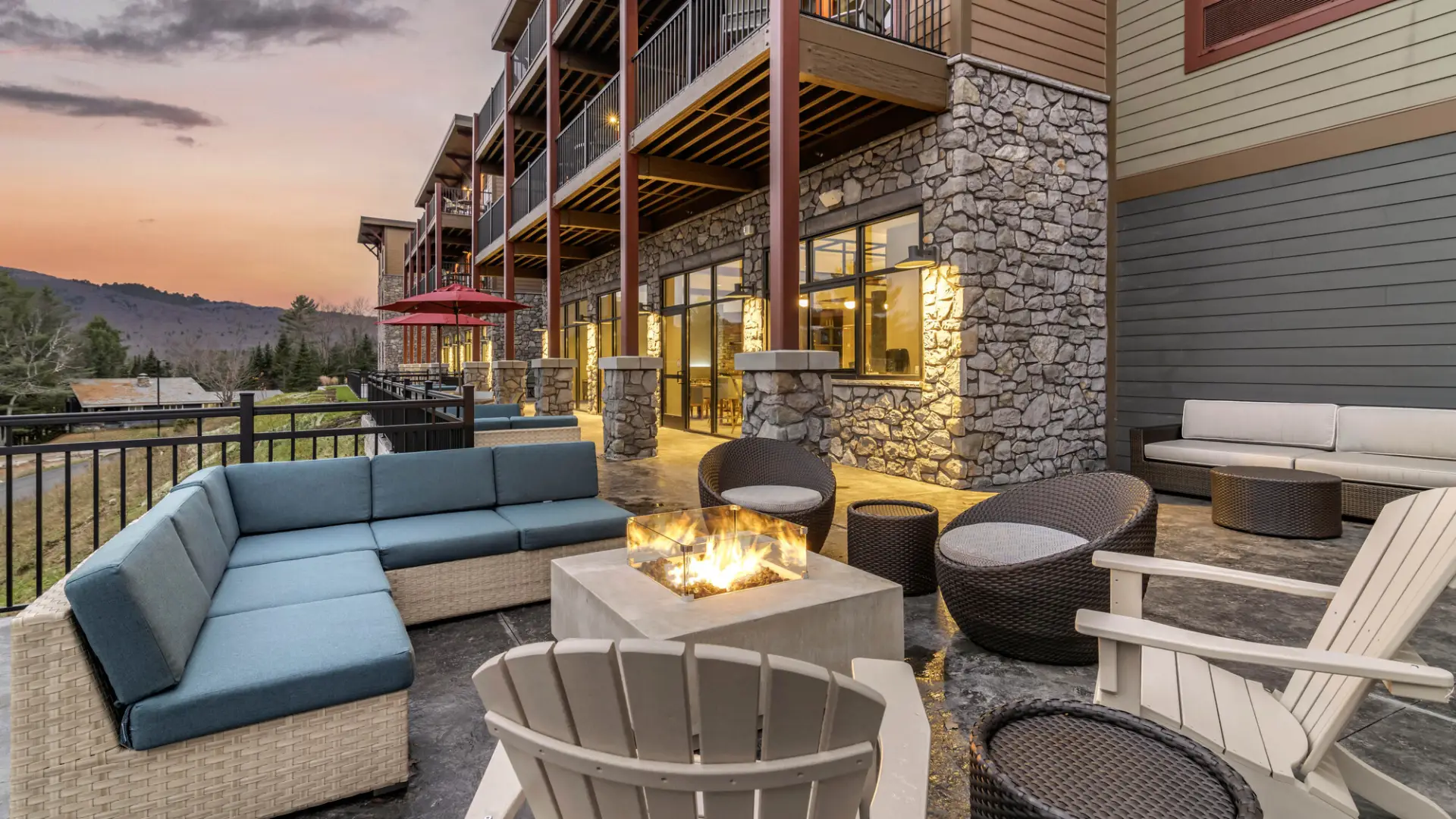 The stylish exterior deck with lounge furniture at a hotel.