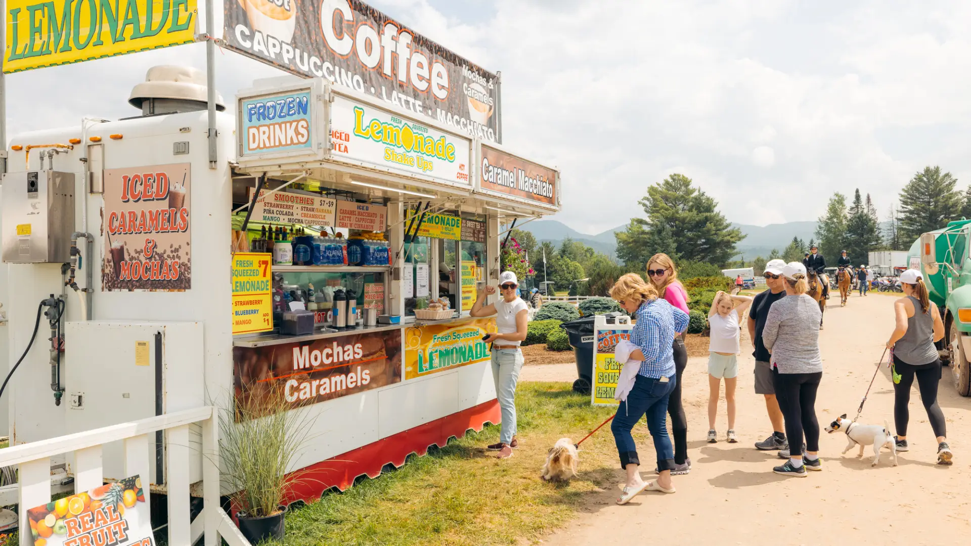 A beverage vendor at the horse show.