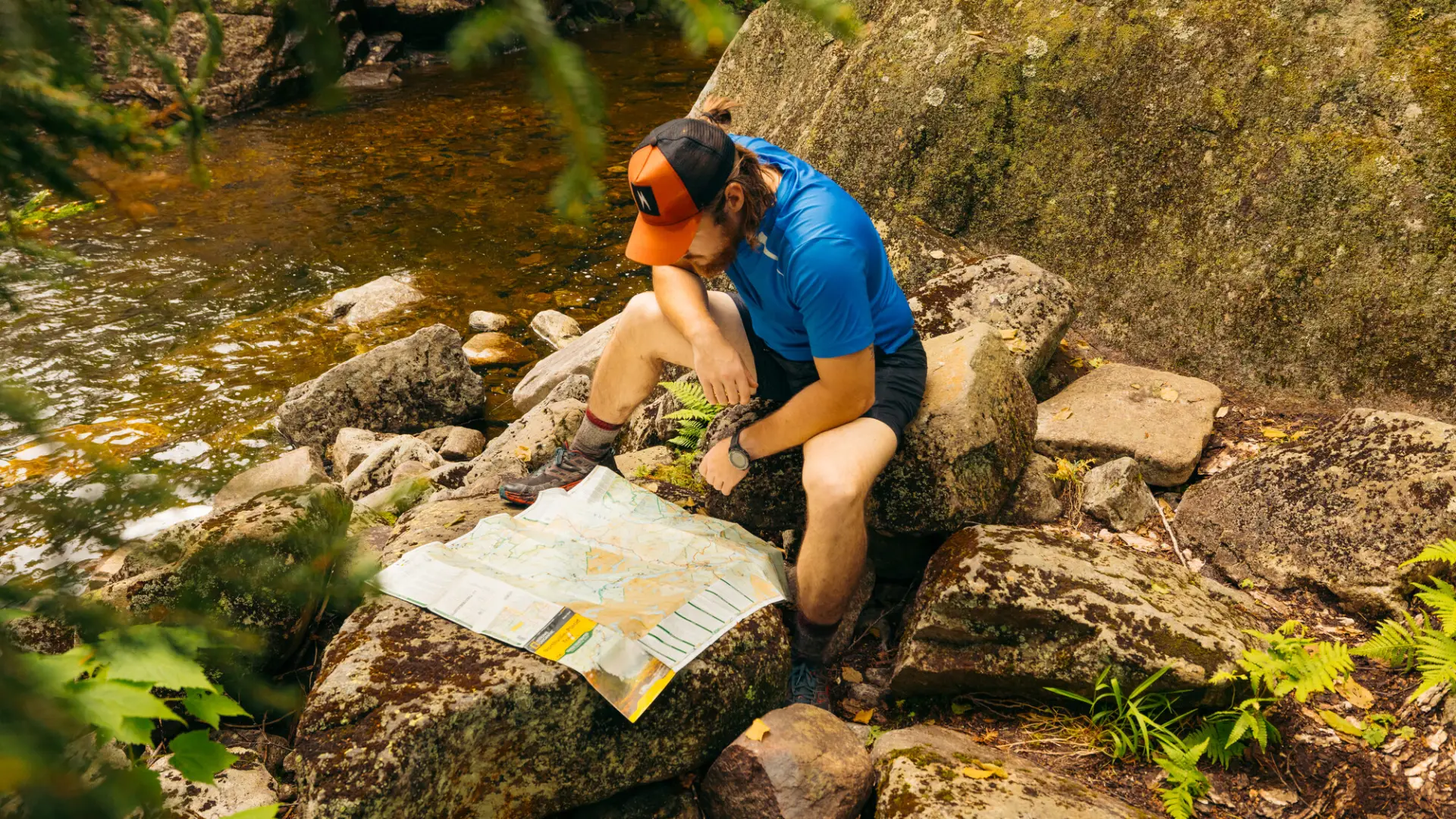 A hiker checks a map.
