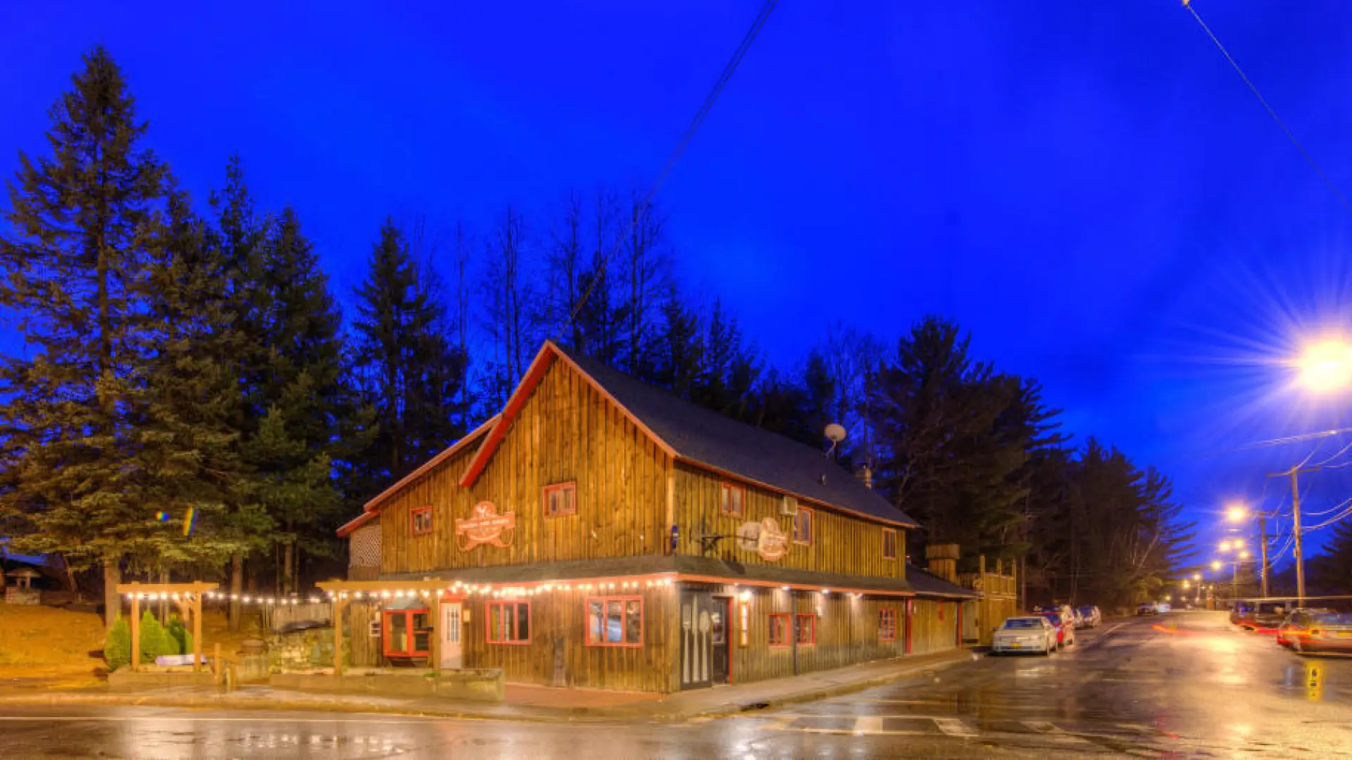 Liquids and Solids restaurant with its lights shining upon Sentinel Road at night
