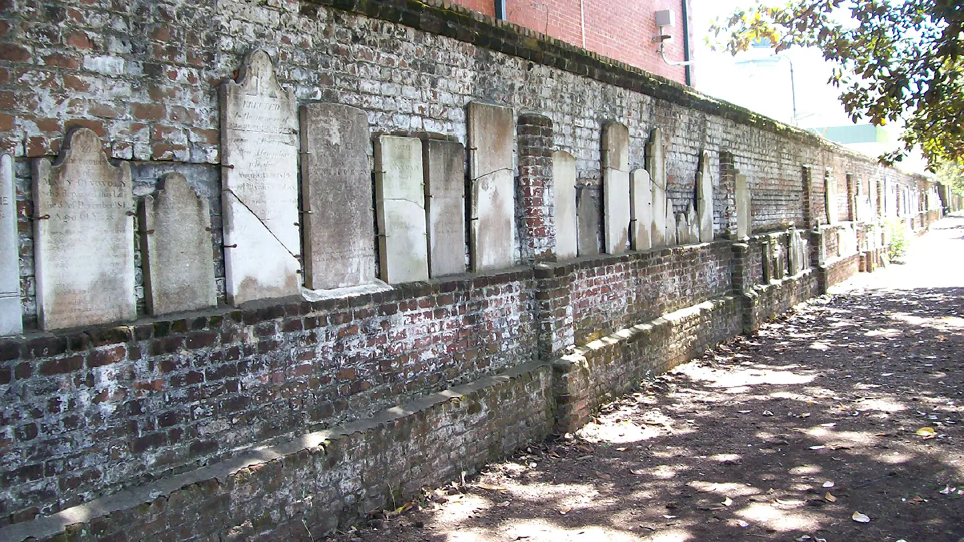 Brick wall with headstones in Colonial Park Cemetery