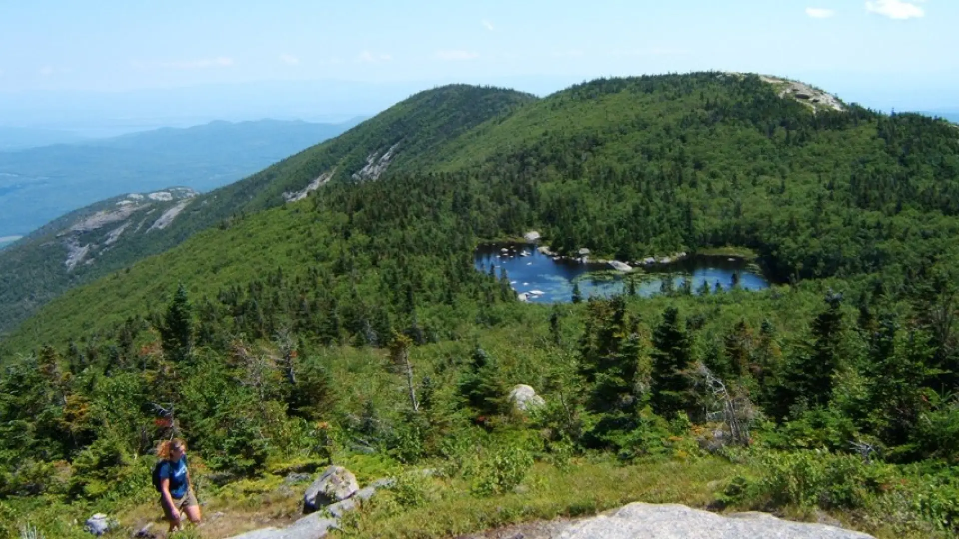 A high elevation lake appears on the way to the summit.