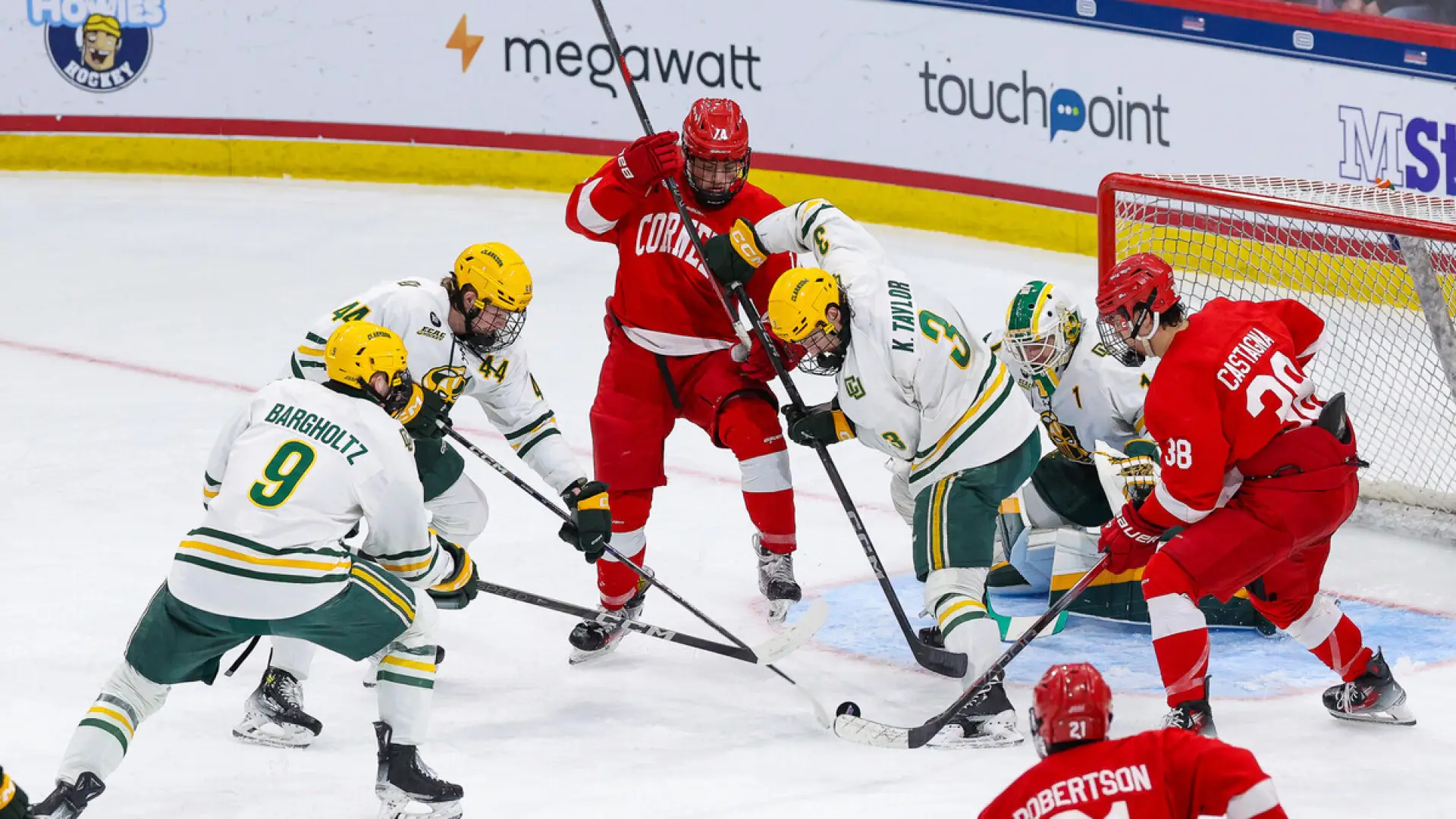 The image captures a close-up of hands reaching out, wearing red hockey gloves. 