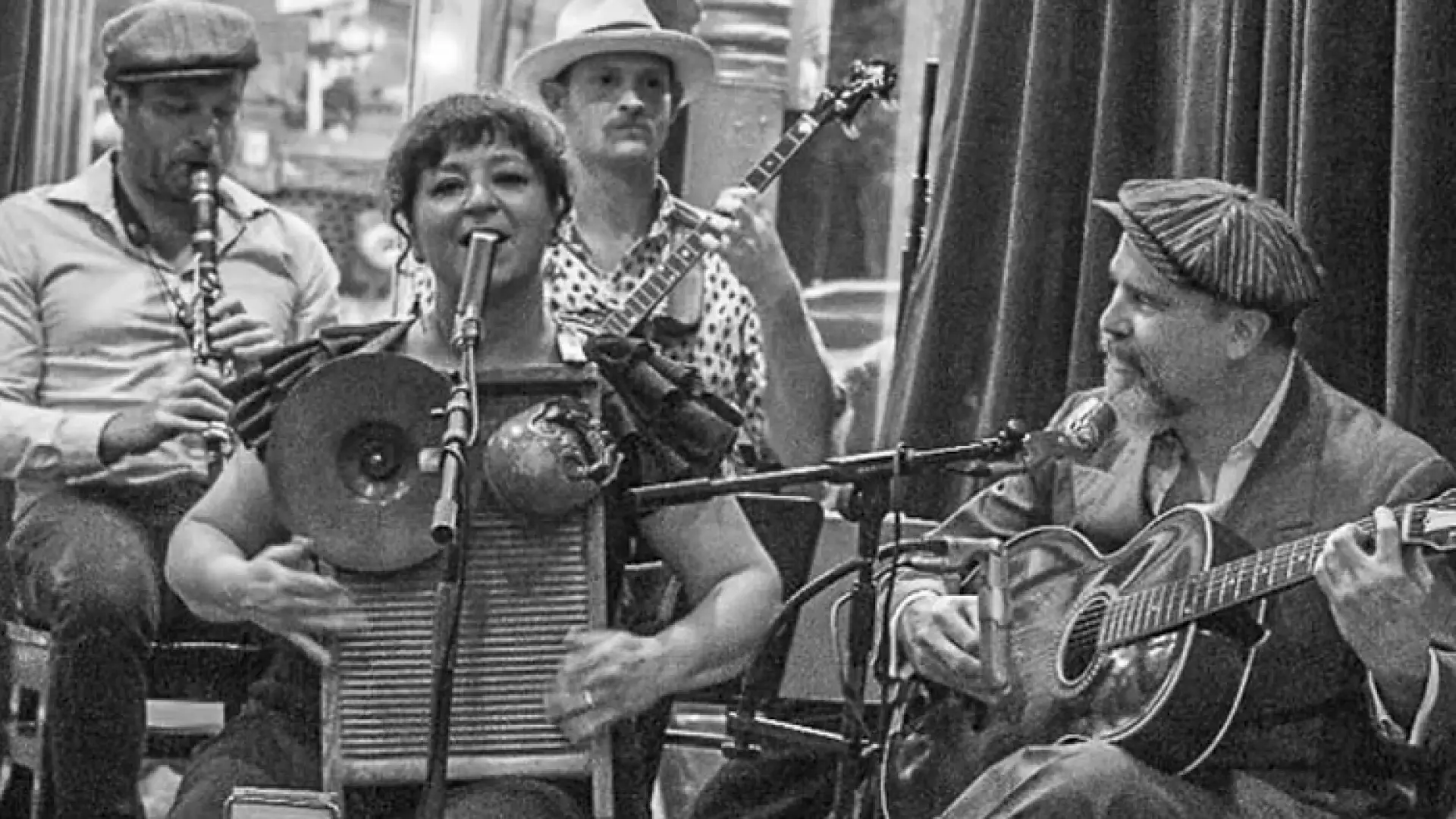 Black and white grainy photo of Bad Penny Pleasuremakers performing