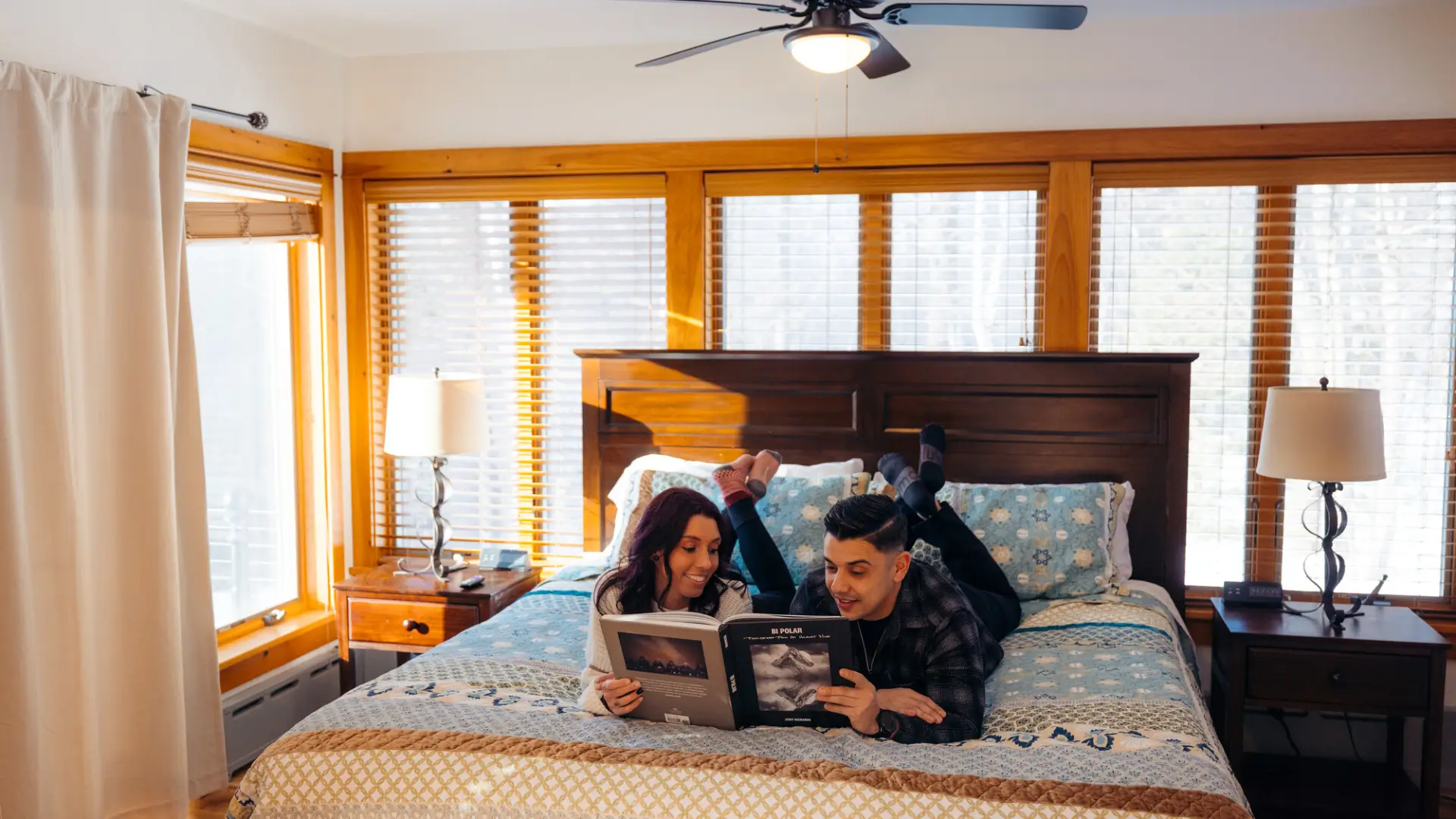 Enjoying the spacious bedroom, walled with windows at the Algonquin Mountain Chalet.