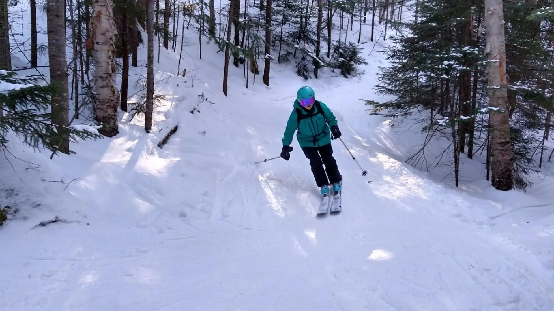 back country skier slides towards the camera
