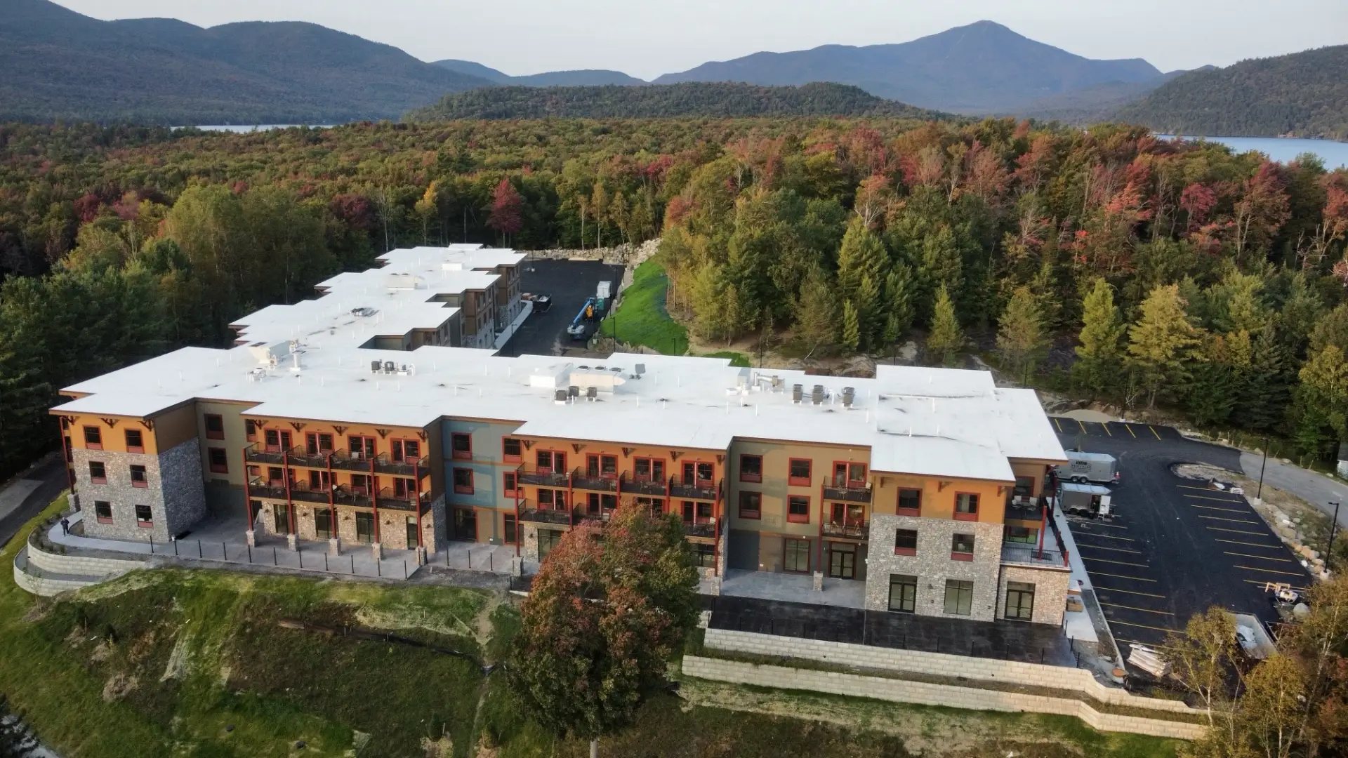 Aerial View of the Cambria Hotel in the fall displaying beautiful foliage and the surrounding mountains.