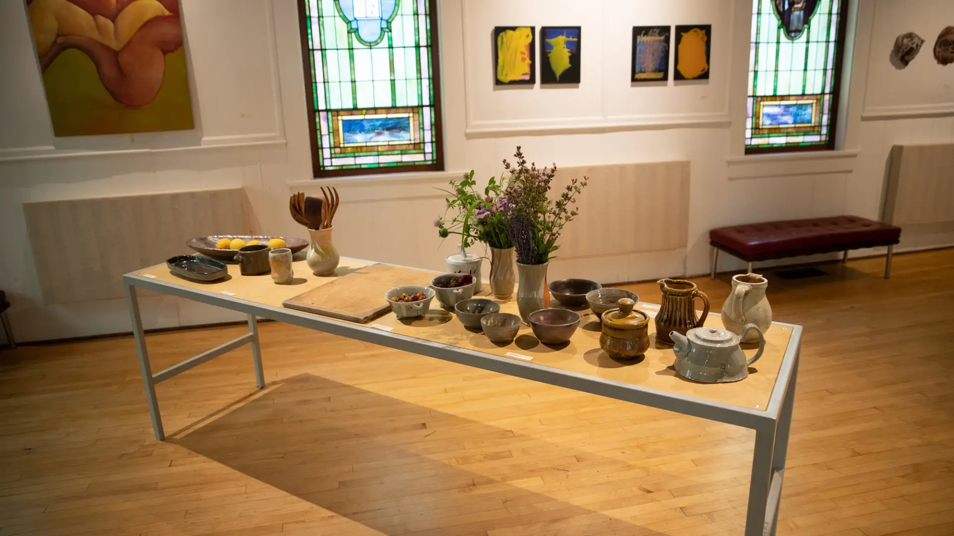 Assorted art on a table in a Lake Placid gallery.