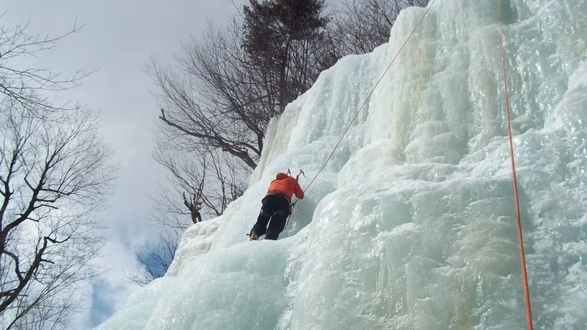 An ice climber on top rope