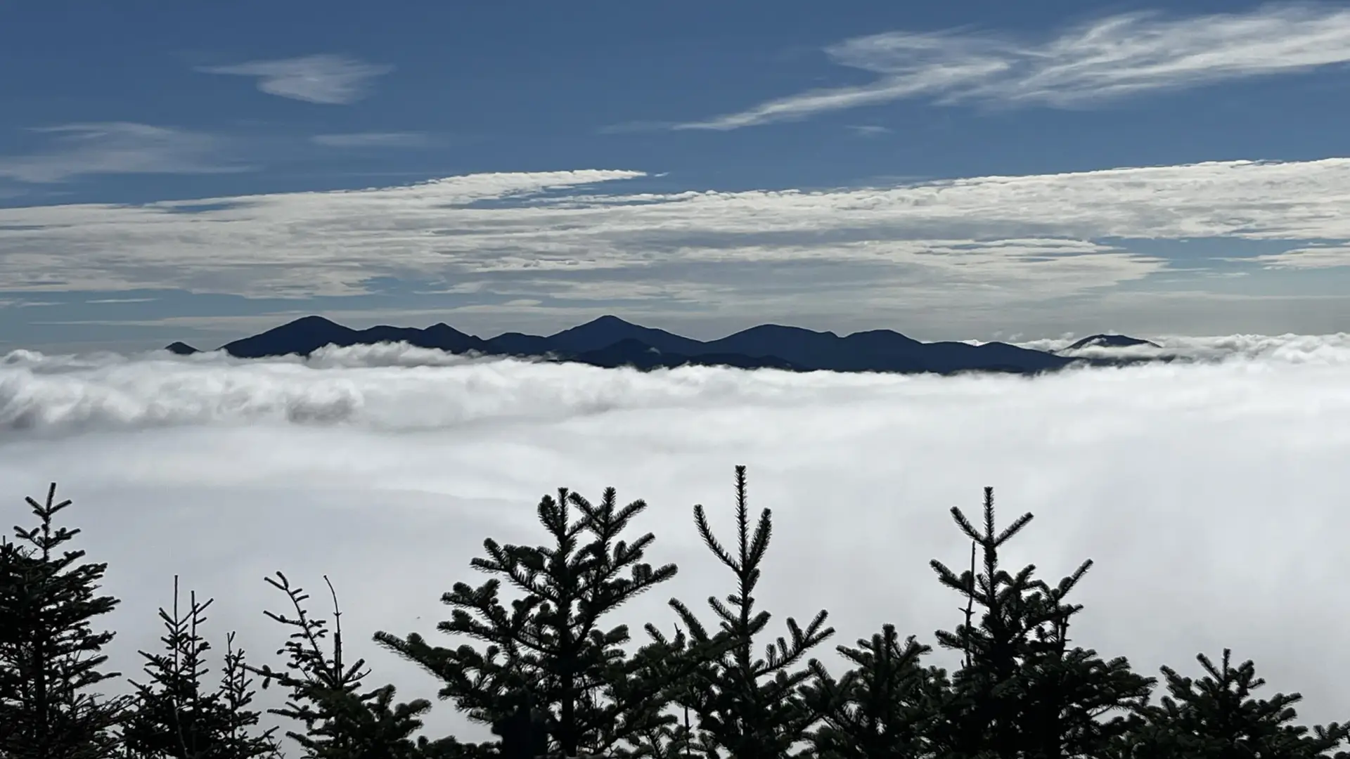 Mountains peek out from the clouds