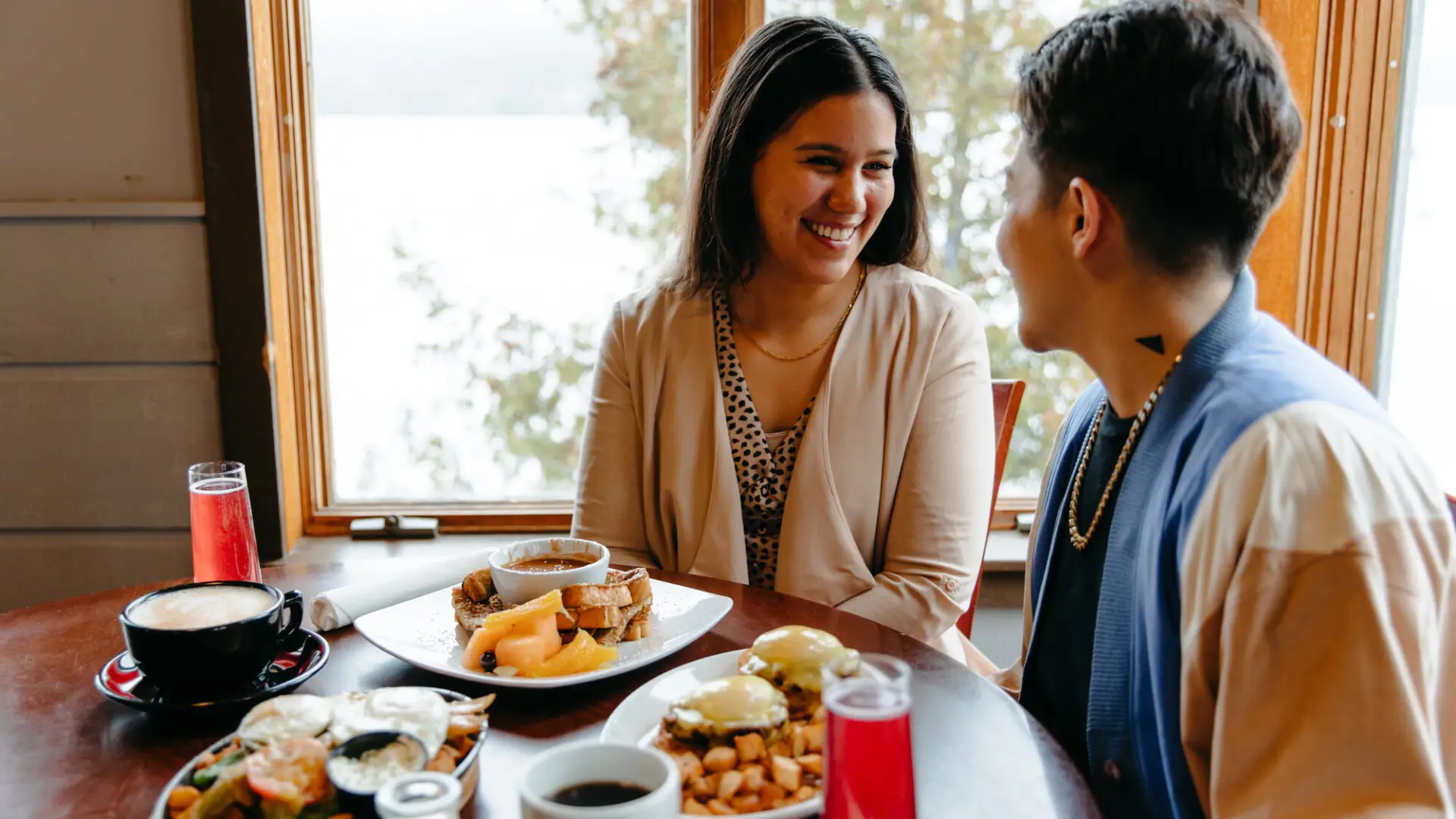 Two women enjoy breakfast together. 