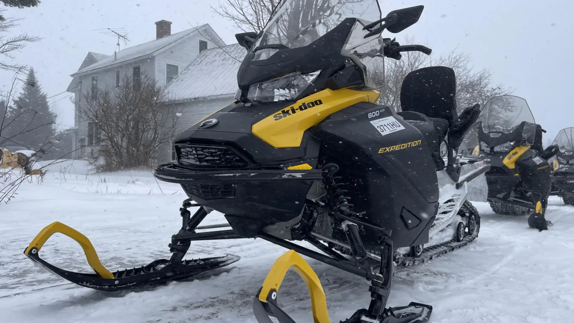 A snowmobile close up in the snow.