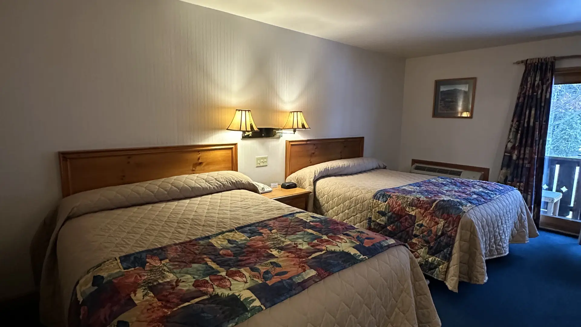 A two queen room with colorful quilts at Wildwood on the Lake.