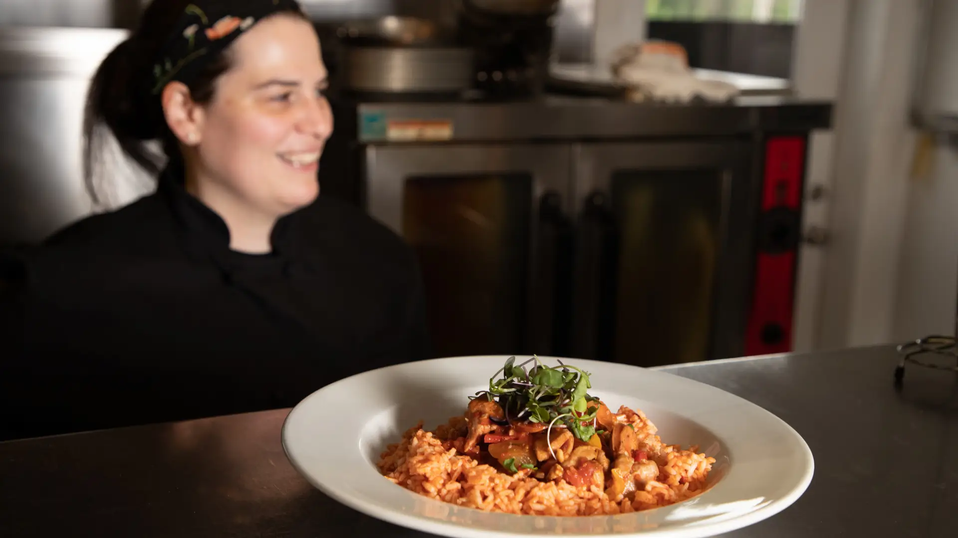 Chef with her dish on the counter
