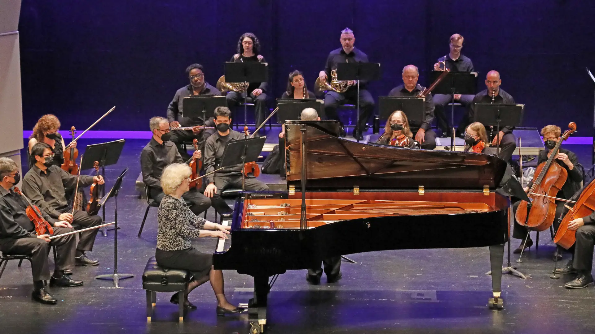 Grand Piano surrounded by orchestra