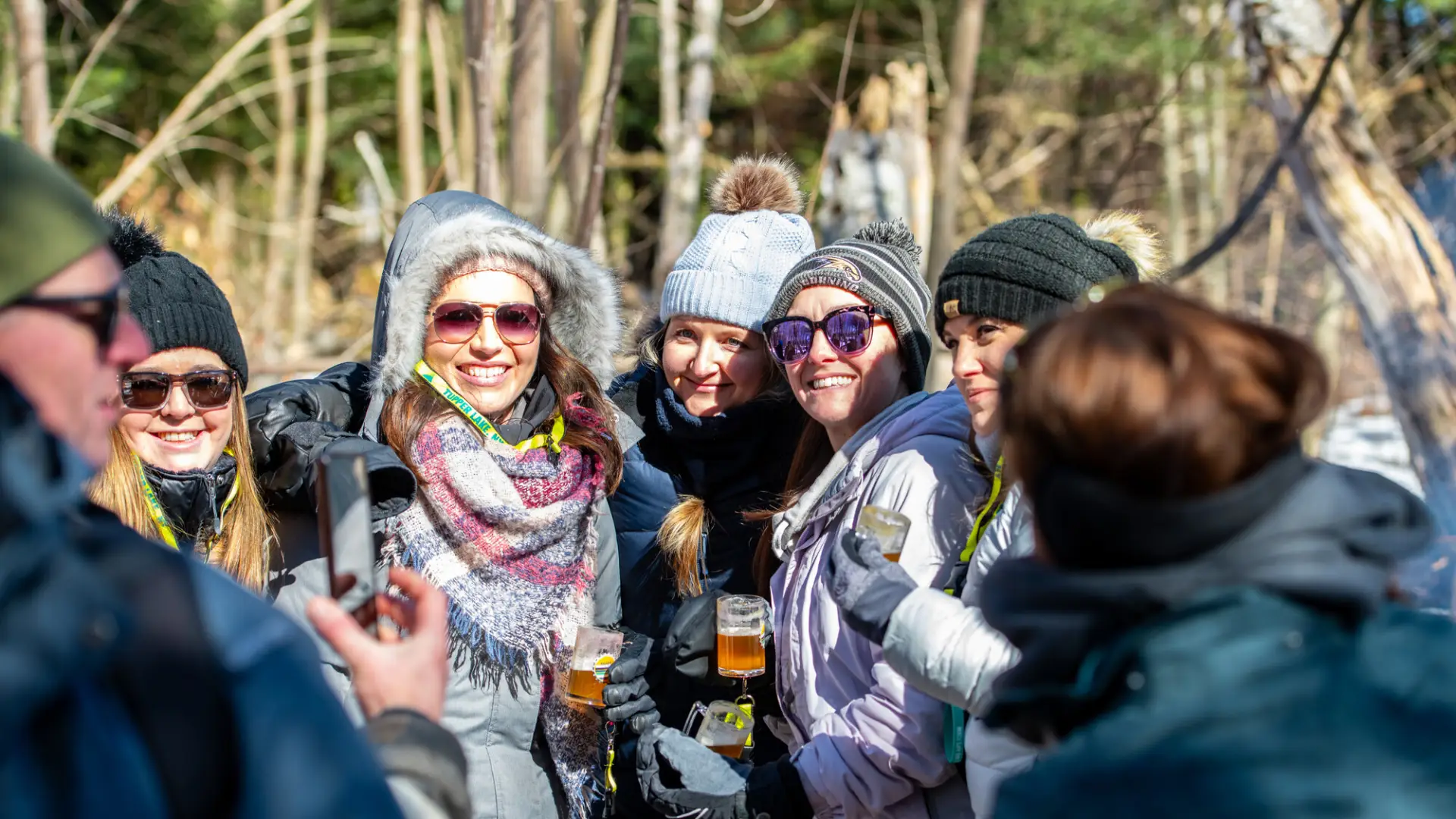 Group of skiers cheers on the trail.