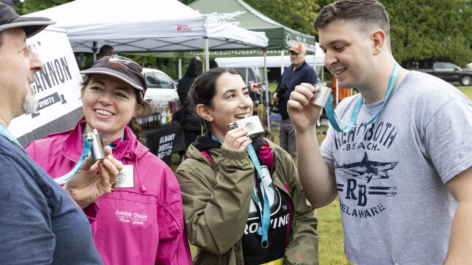 Racers sip from Whiskey Run flask medals