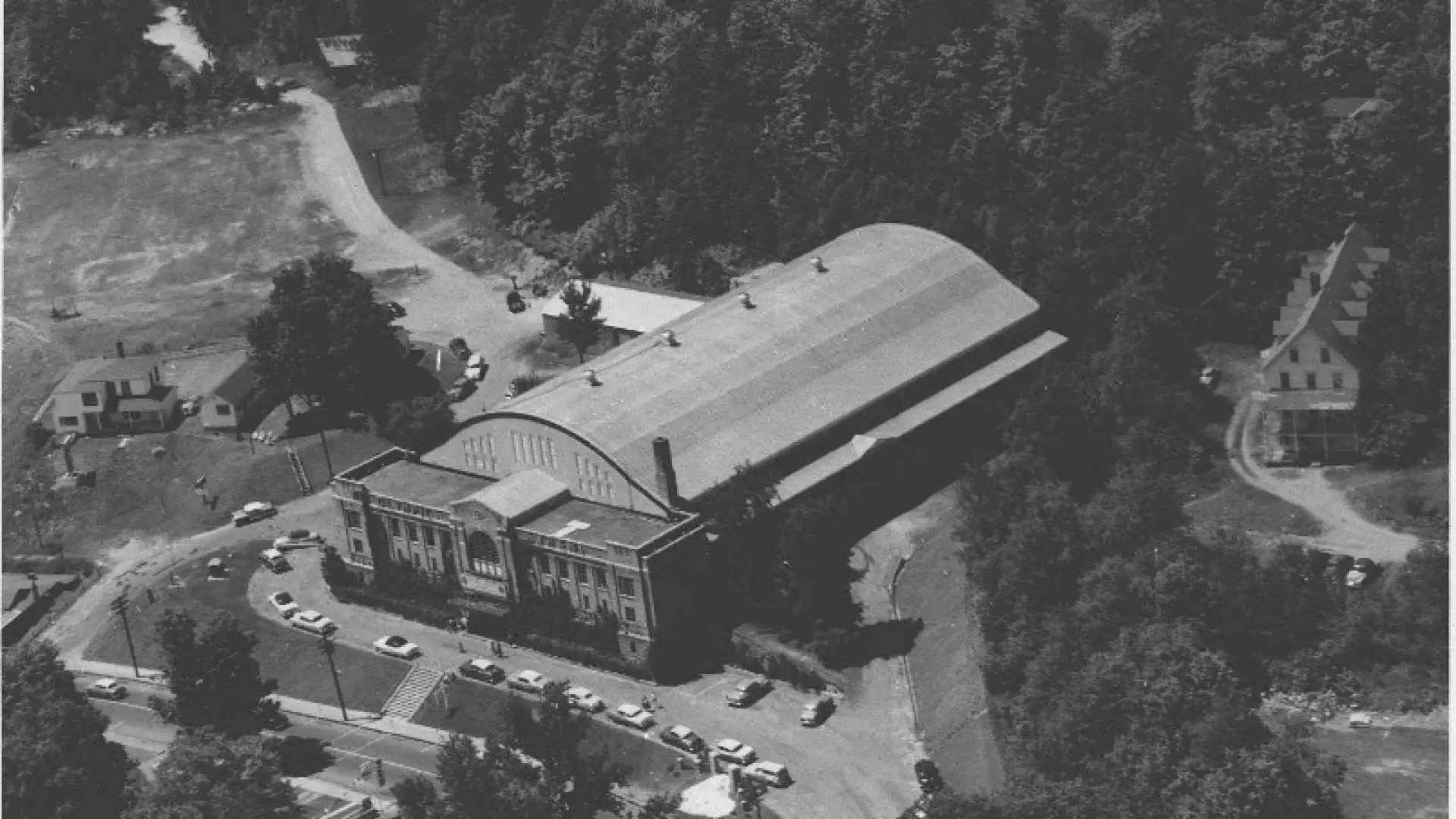A black and white aerial view of the 1932 Olympic arena, circa 1950. Image courtesy Lake Placid Public Library.