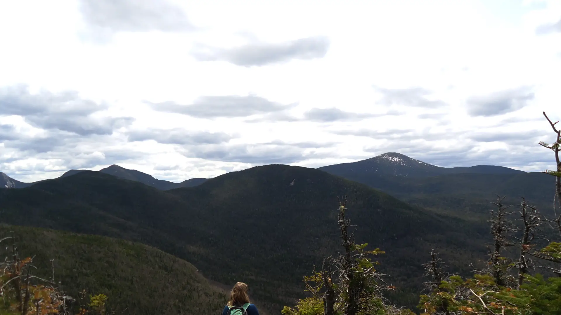 A hiker on a mountain top