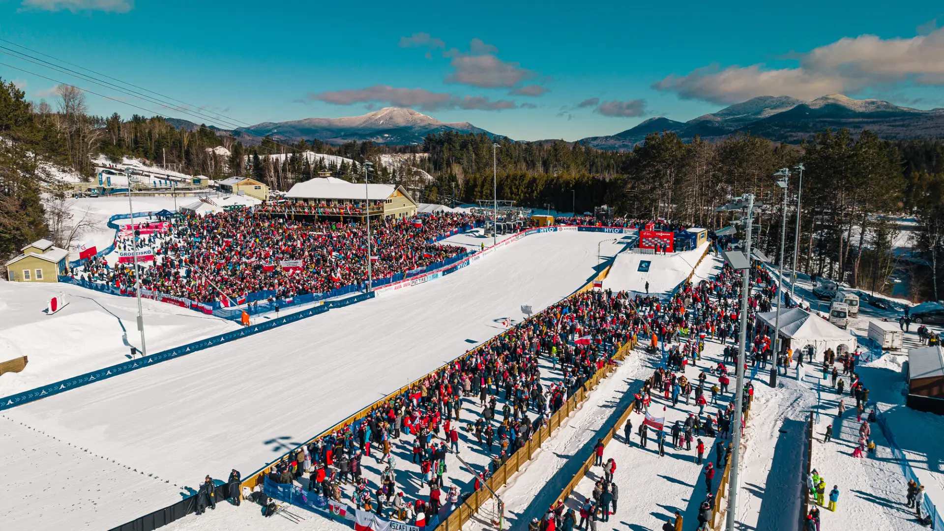 Aerial view of spectators at a ski jumping event.