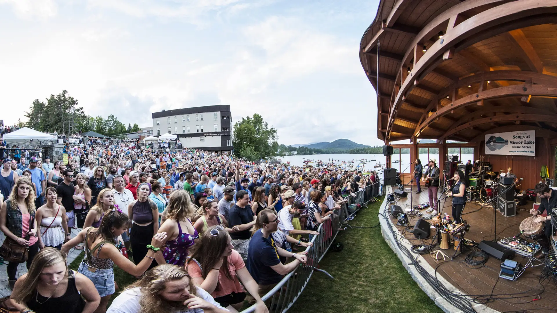 A crowd of people watching live music in Lake Placid.