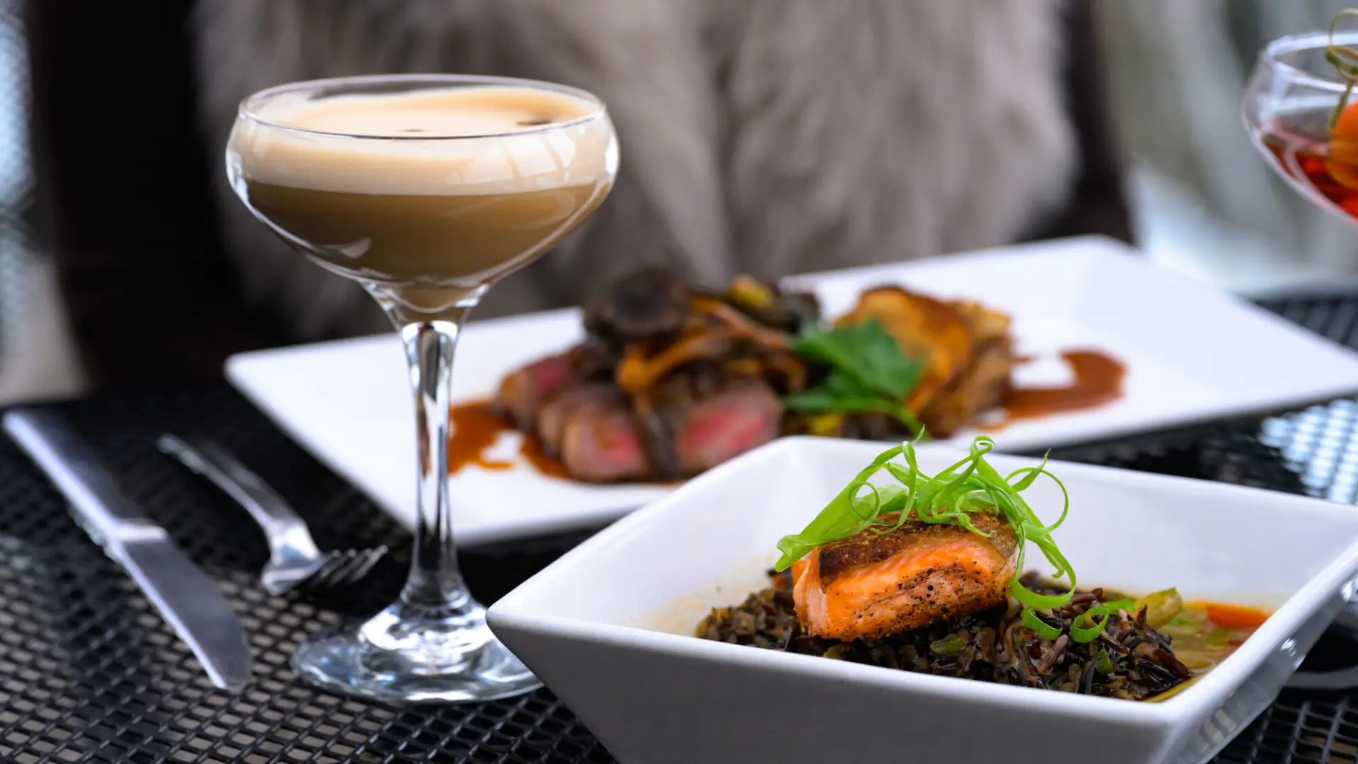 Fine dining plated food on an outdoor patio during the winter.