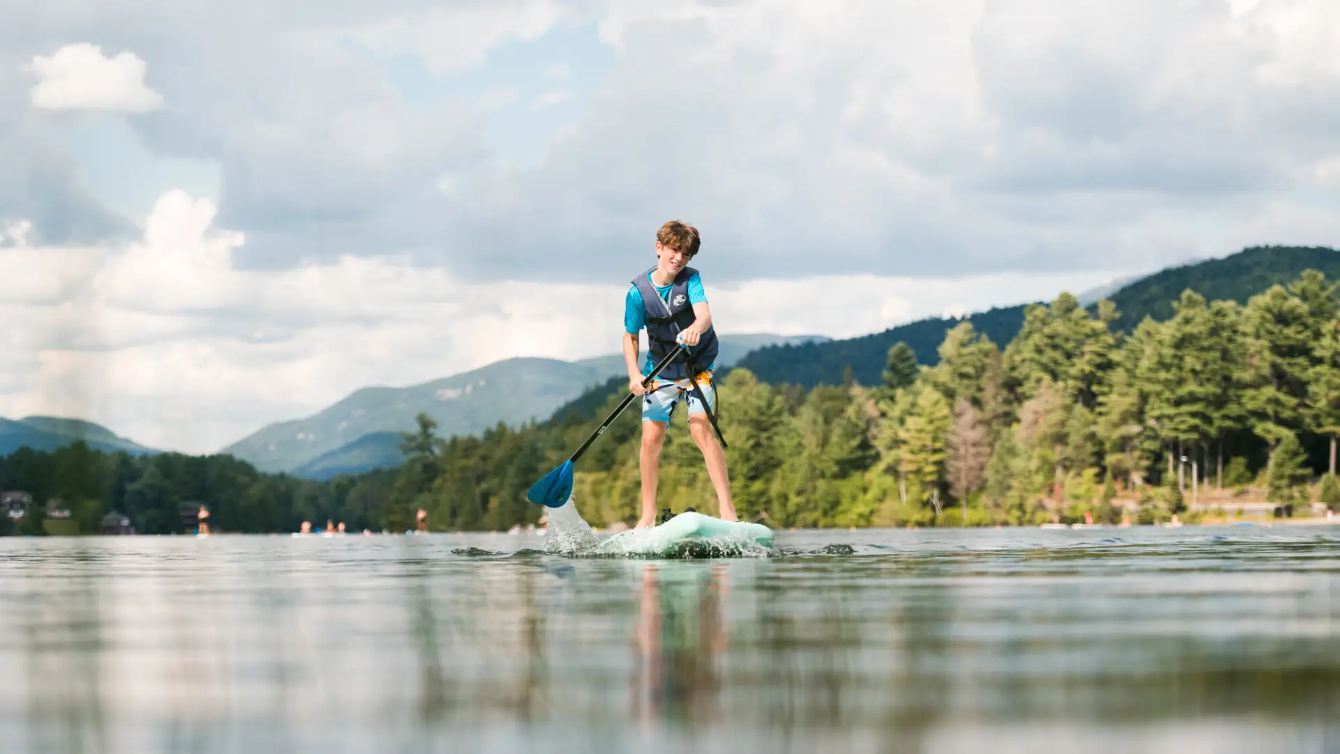 A paddleboarder on the lake.