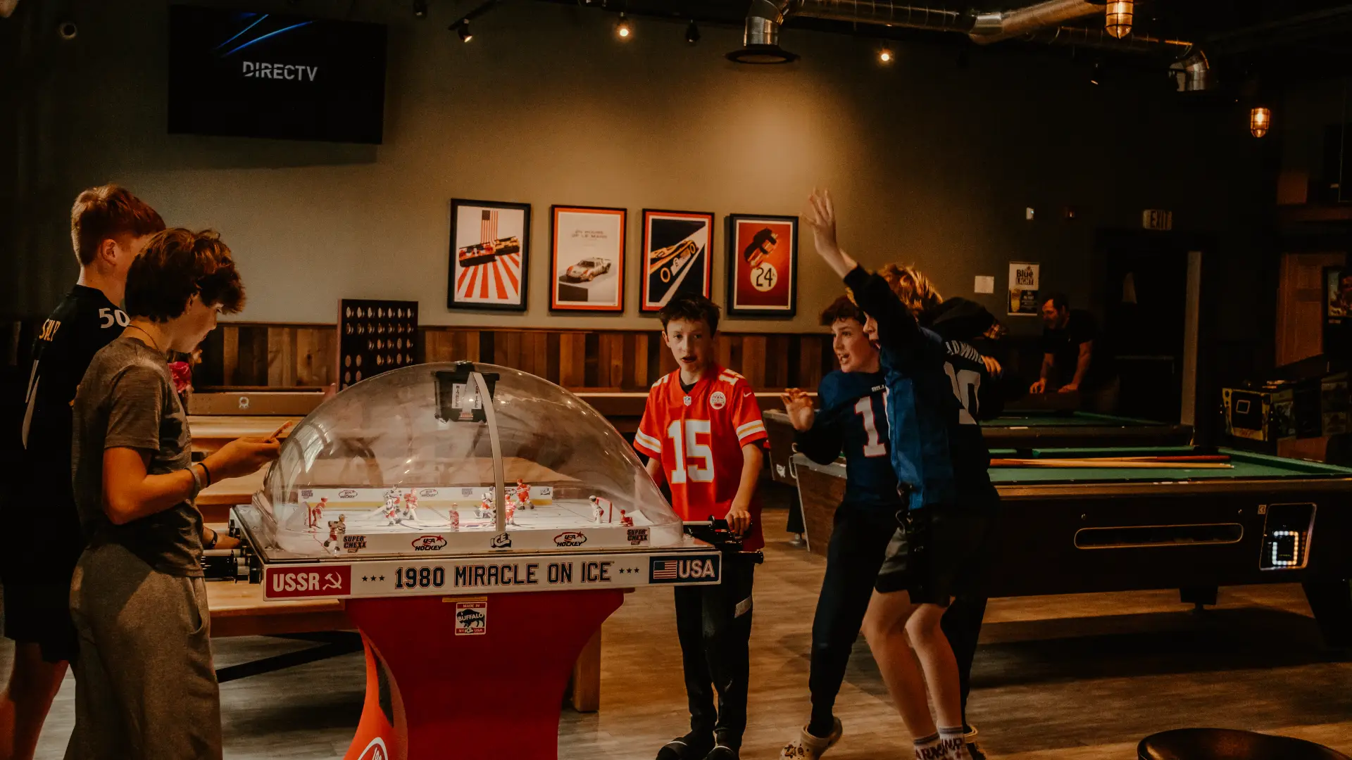 boys play the 1980 miracle on ice theme fooseball hockey game.  Photo Credit to A. Kelly.